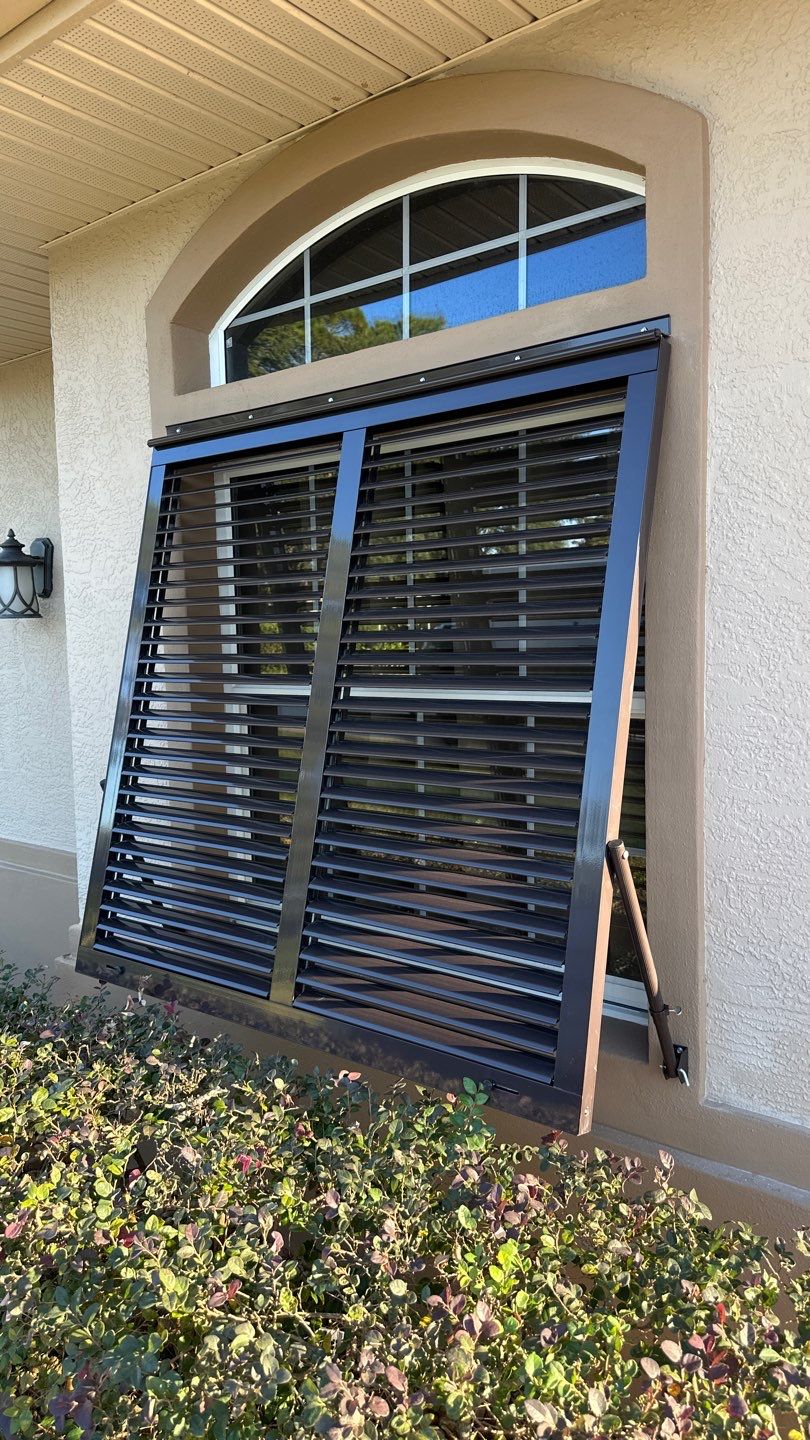 Hurricane Rated Bahama Shutters in Gray Brown by Smart Guard Shutters