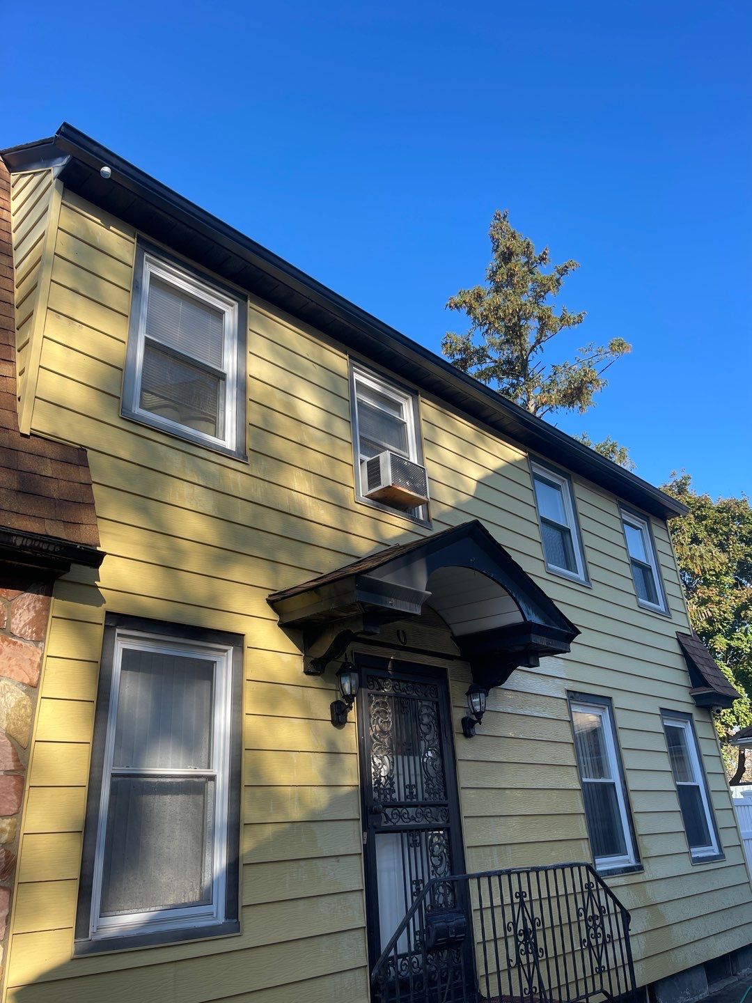 Full House Installation 5" black seamless gutters and 2x3 leaders using 5" black K style seamless gutters and 2x3 black leaders by Above All Gutters 