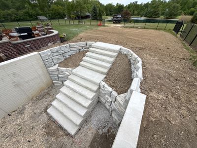 Basement Walkout Construction with Tiered Retaining Walls in Berkey