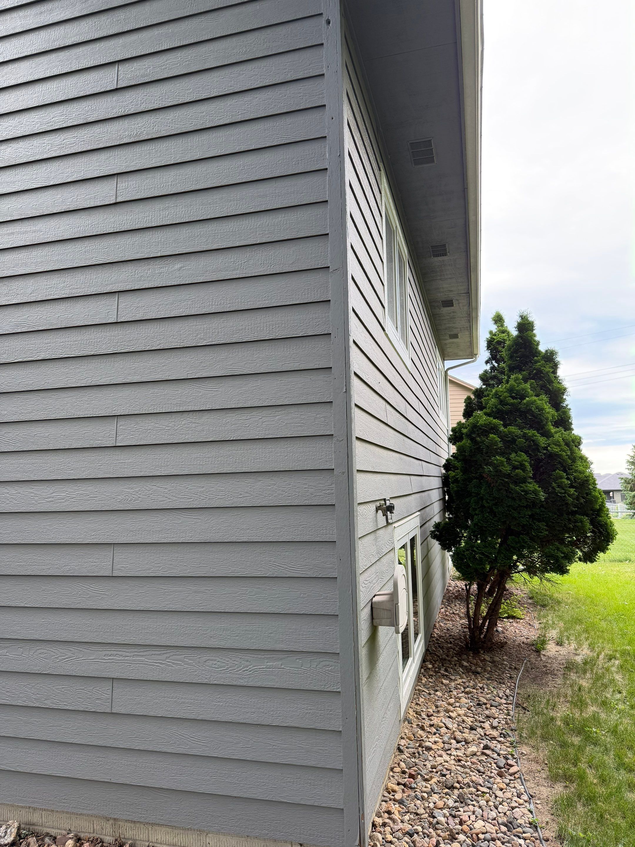 Full Exterior Painting for Gray Siding and Trim in Sioux Falls by Select Painting, Coatings & Garage Cabinets