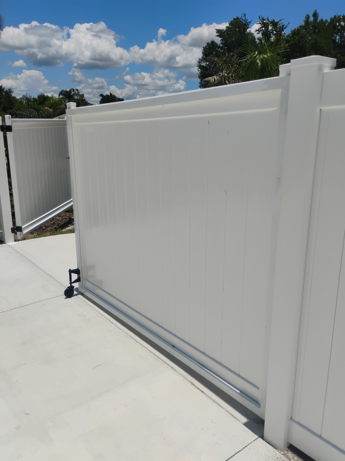 White Vinyl Privacy Fence Installation and Gate Repair in Port Charlotte by True Fence LLC