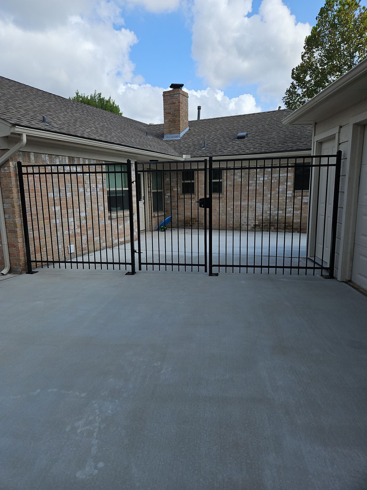 Iron fence installation using 6ft - 3 Rail - Ameristar Montage by Tim's Fences