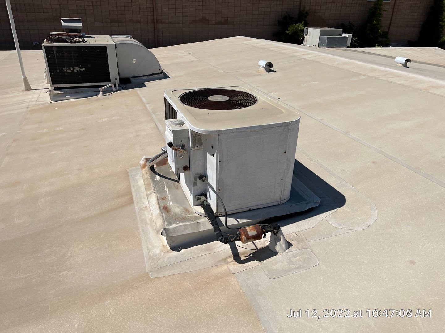 MR Roofing system using Benchmark/PUMA XL coatings over TPO single-ply roofing by Straight Edge Roofing Inc