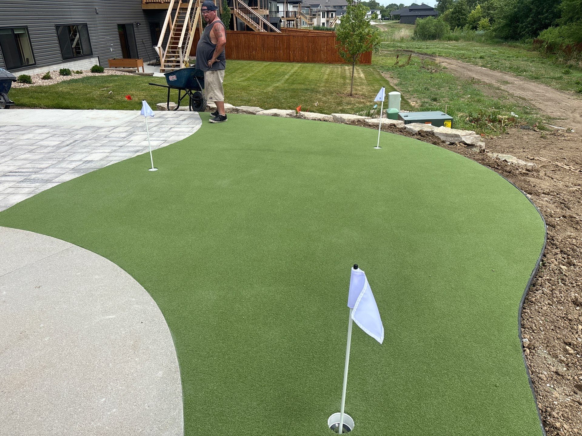 New Residential Construction - Paver, Putting Green, Pool by New Horizon Landscapes