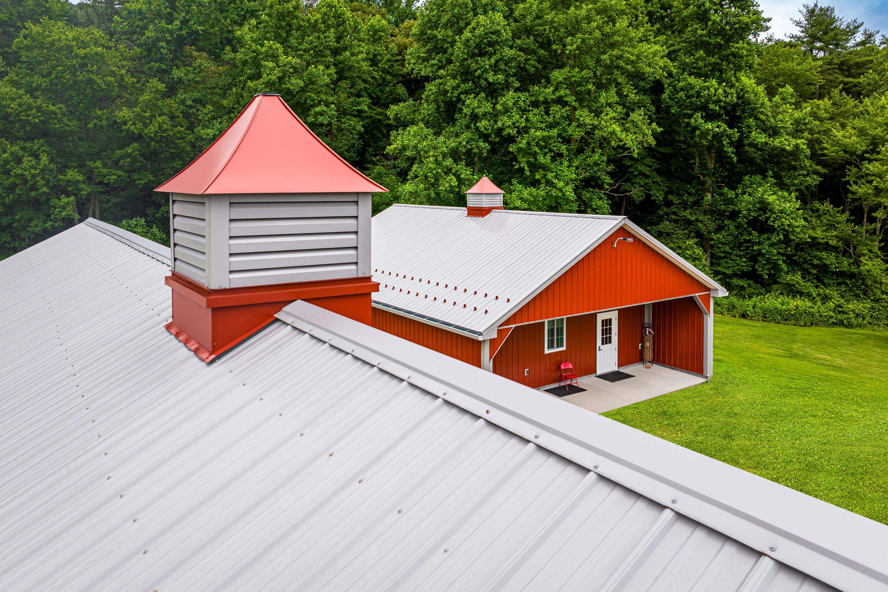 Metal roof -barn red, and New garage by Esh Builders
