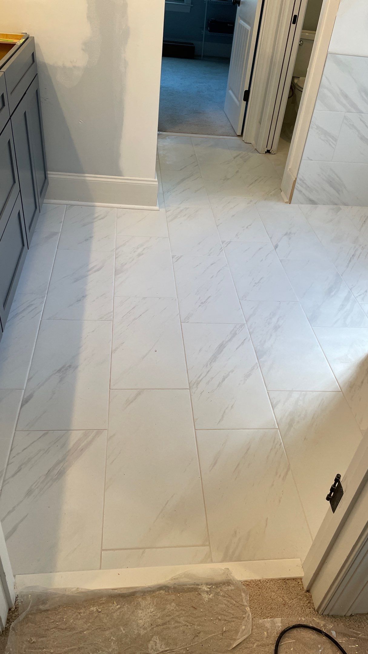 Bright Bathroom Remodel with Wall Removal, Stand Alone Tub and New Vanity by Footprints Floors of Coastal Carolina