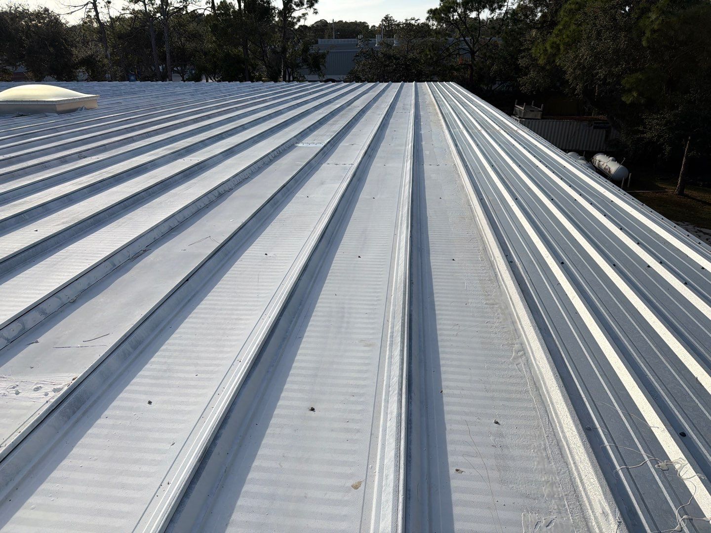 Sarasota Industrial Warehouse Metal Roof Silicone Coating Restoration by CES Roofing