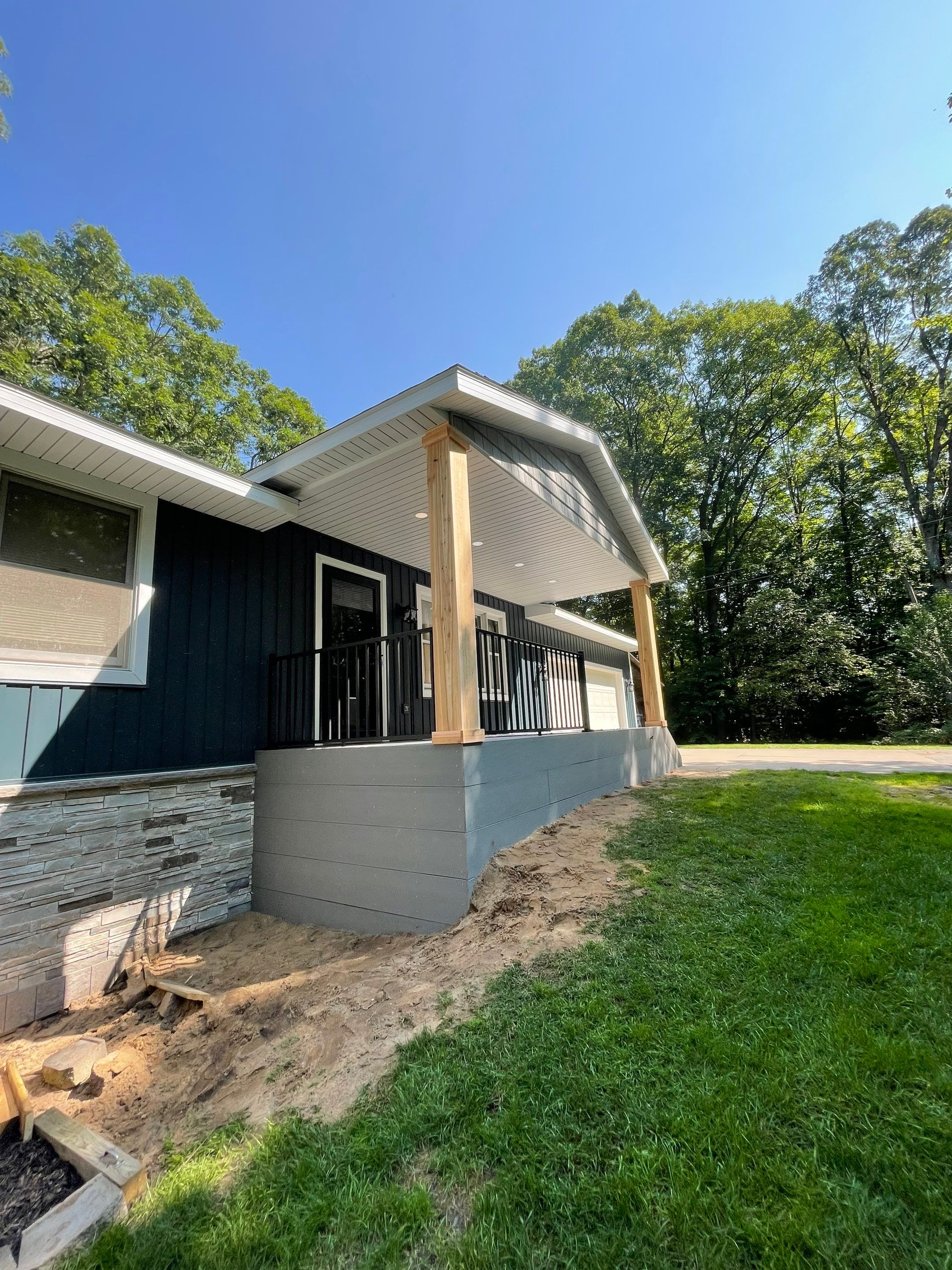 Siding, Deck and Versetta Stone by Avalon Roofing and Exteriors
