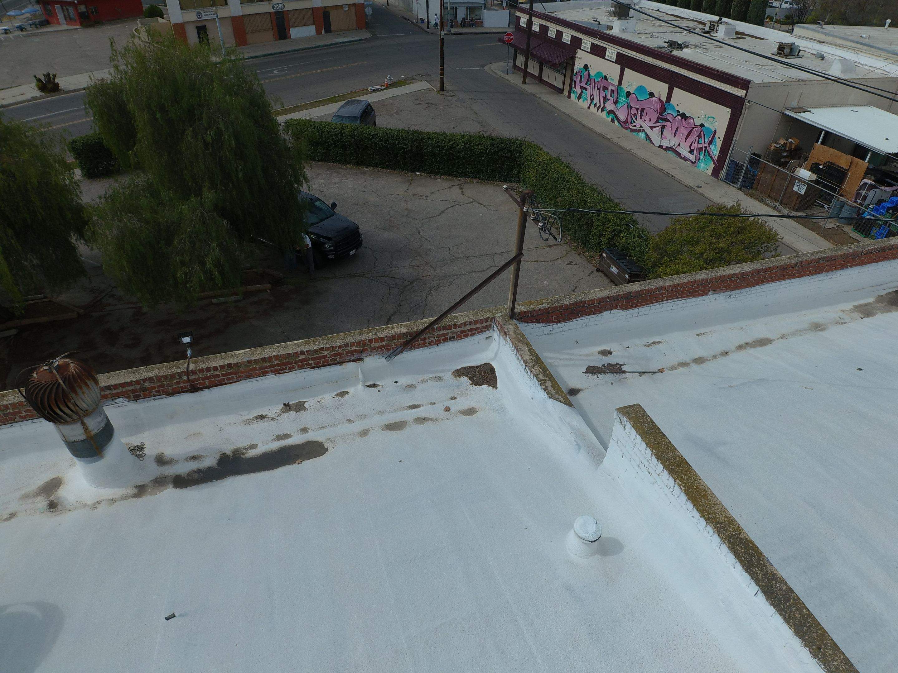 Polyurethane foam roof refurbish and recoating by Straight Edge Roofing Inc