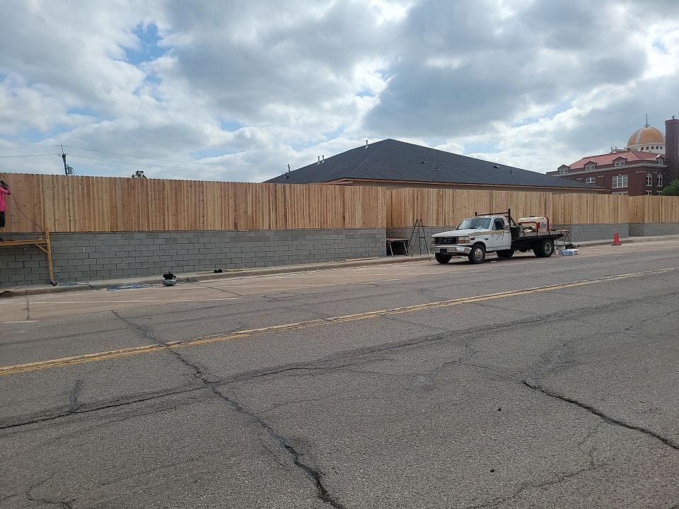 Cedar Fence using Cedar Pickets and Metal Poles by Clays Services Inc