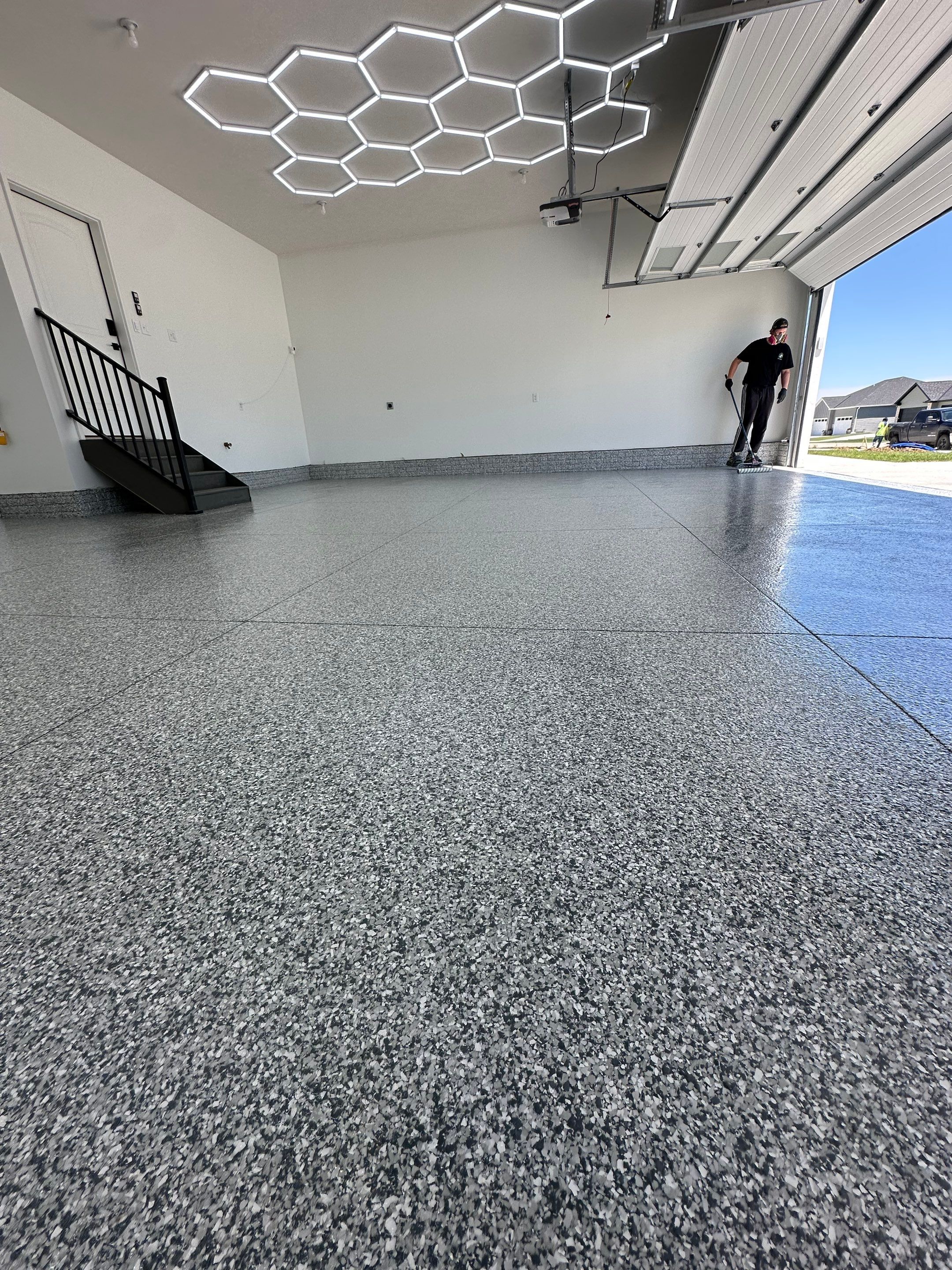 Three-Stall Garage Epoxy Floor Coating and LED Lighting in Lincoln by Goat Coatings