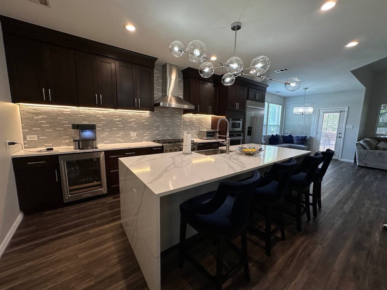 Kitchen Remodel using Calacata Quartz by Construction Nation Group