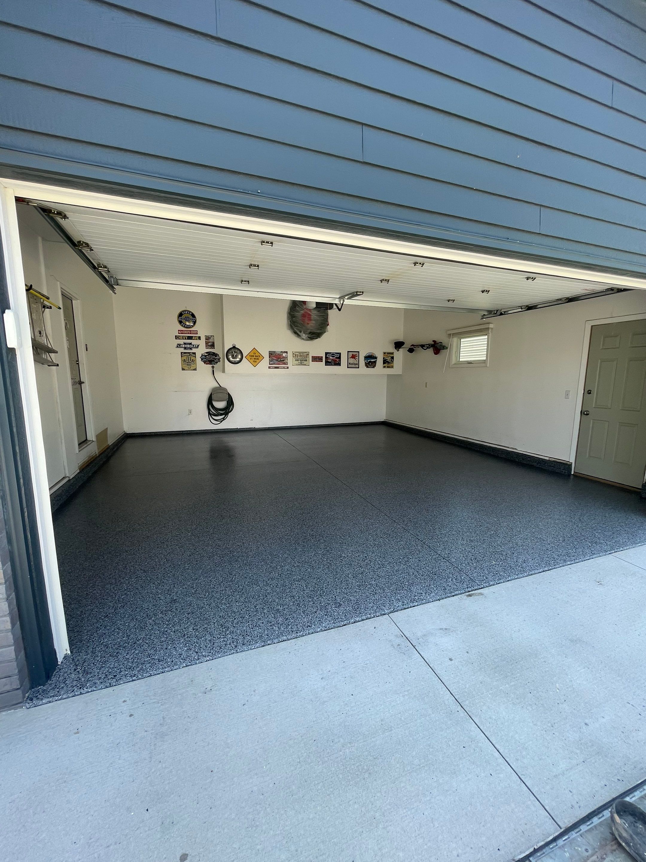 Sioux Falls Garage Floor Coating with Nightfall Decorative Chips by Select Painting, Coatings & Garage Cabinets