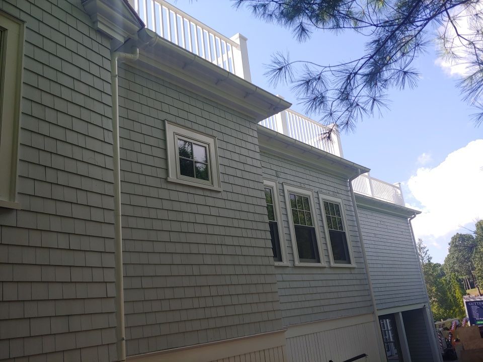 Gutter Installation using 6" Half Round Aluminum Gutter over Crown Moulding by Gutter Pro Enterprises