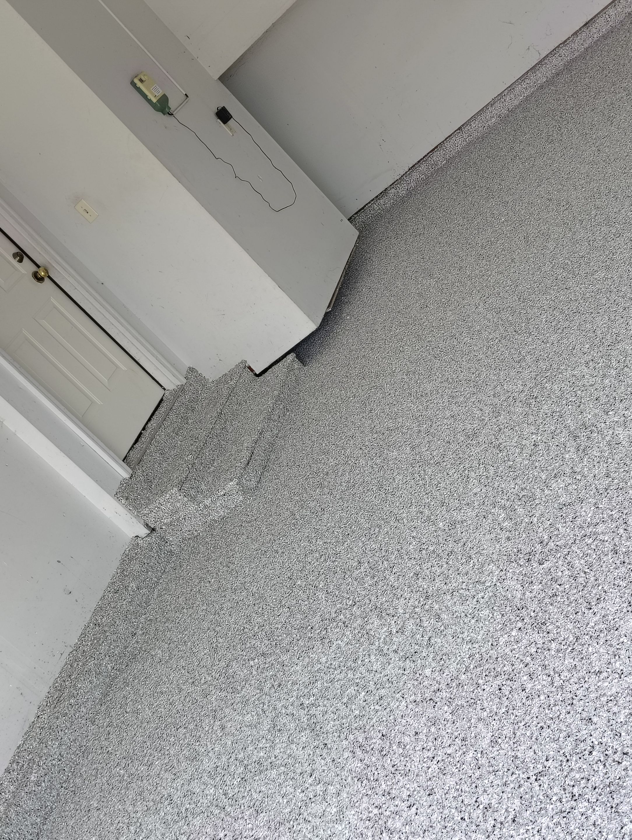 Decorative Chip Epoxy Garage Floor Coating in Sioux Falls by Select Painting, Coatings & Garage Cabinets