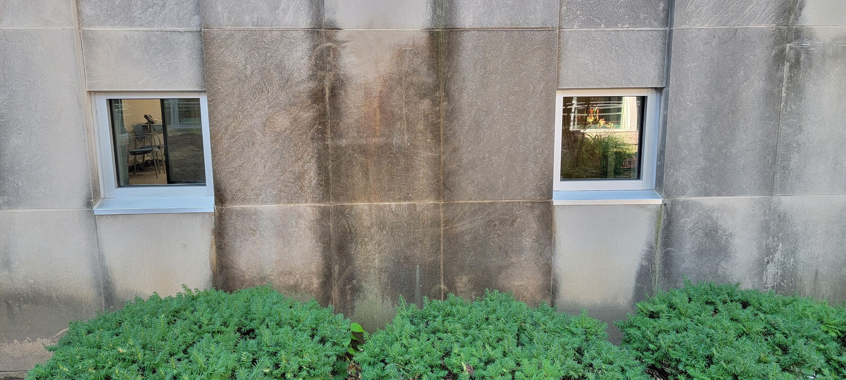 Courtyard pressure washing difficult access.  by Northern Power Washing LLC.