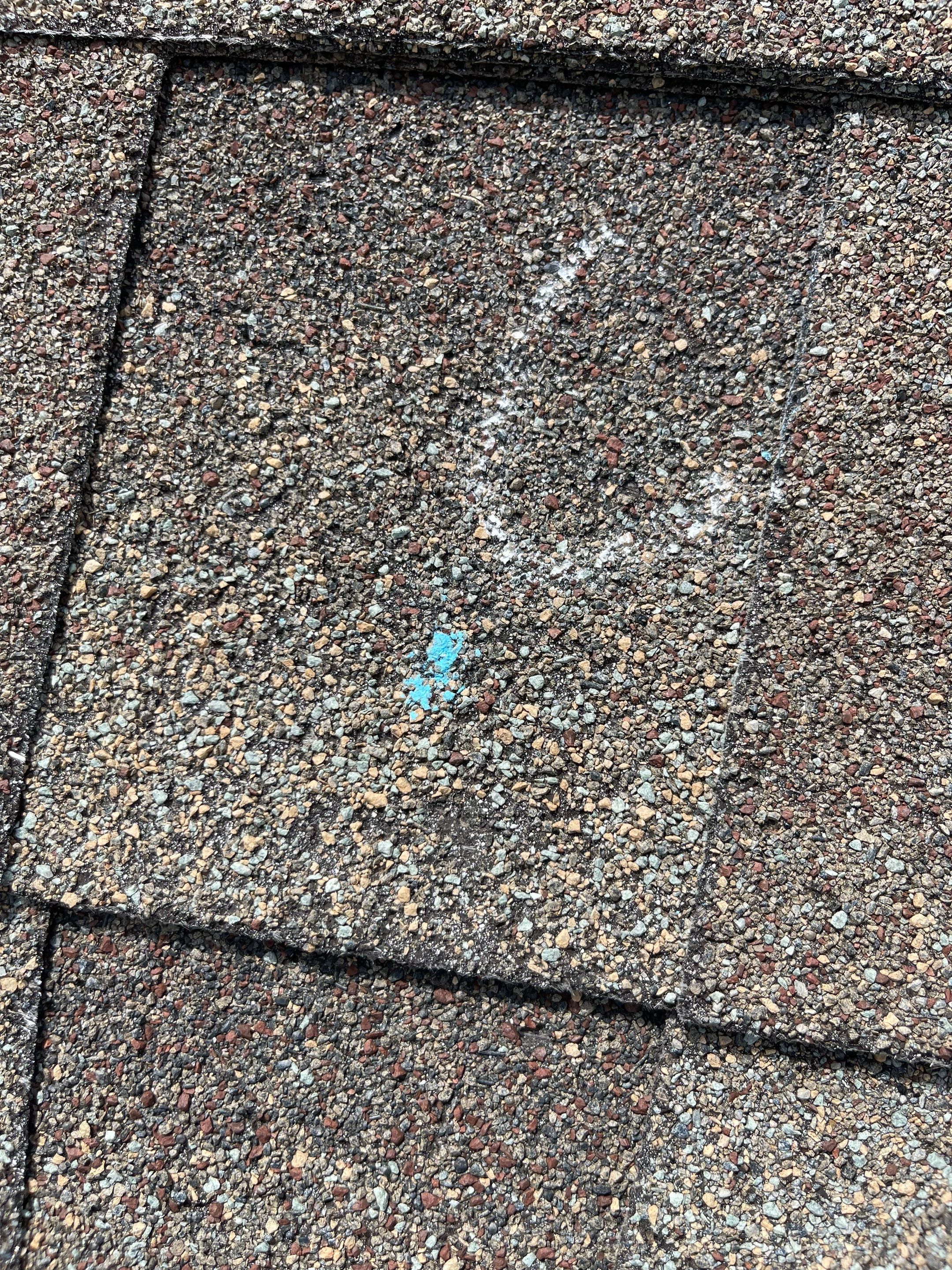 Hail Damage on a Roofing System by Icon Roofing And Construction 