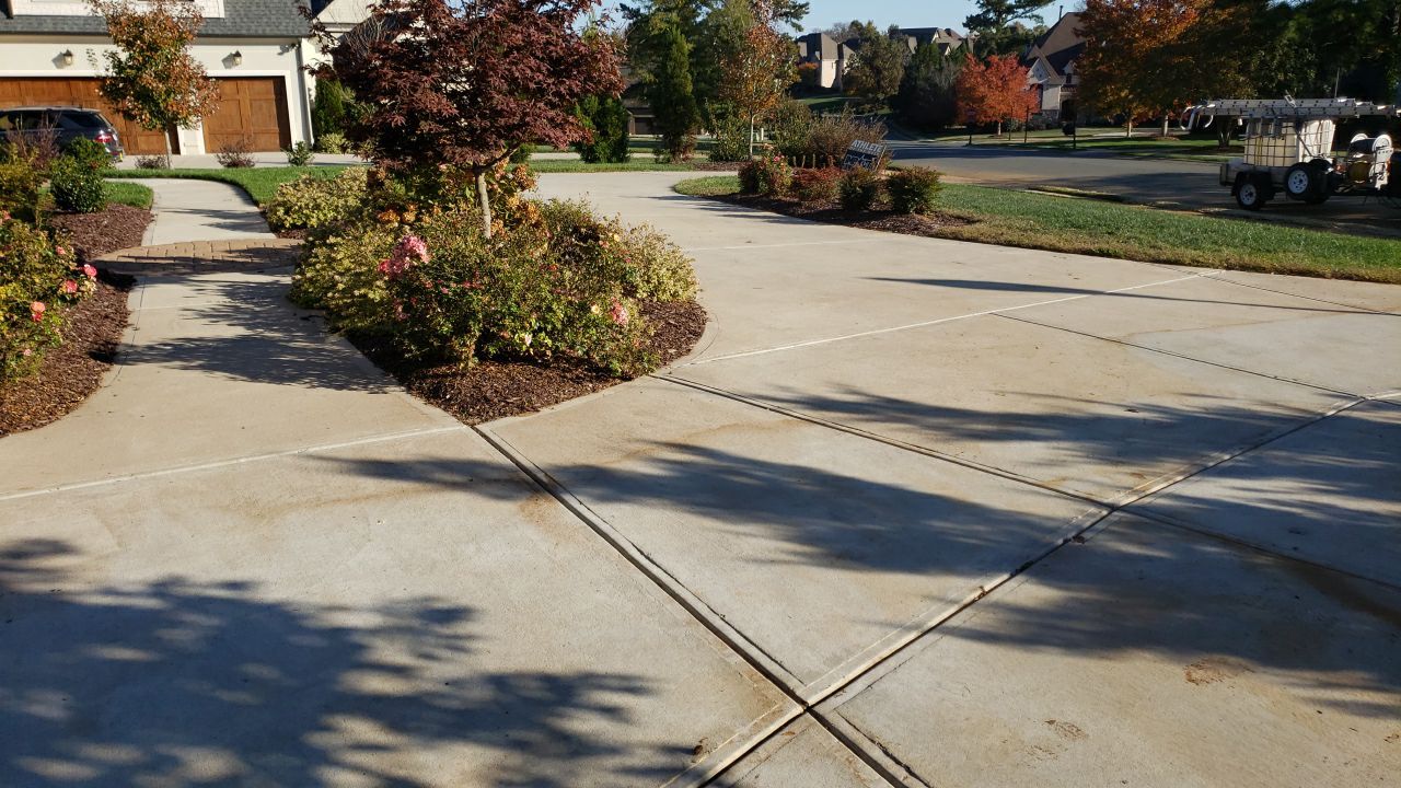 Driveway Clean using cleaner by Power Wash Masters LLC