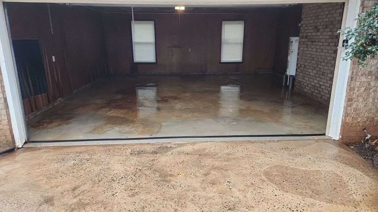 garage floor clean using cleaner by G&H Home Tech Pros LLC