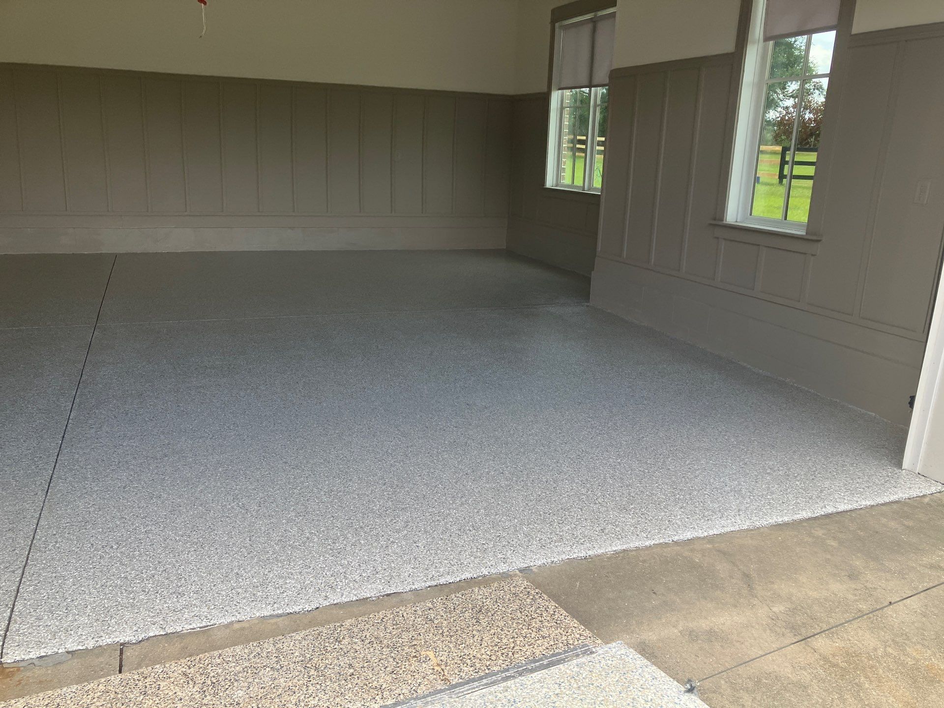 Garage in Mount Everest by Cross Creek Concrete Coatings