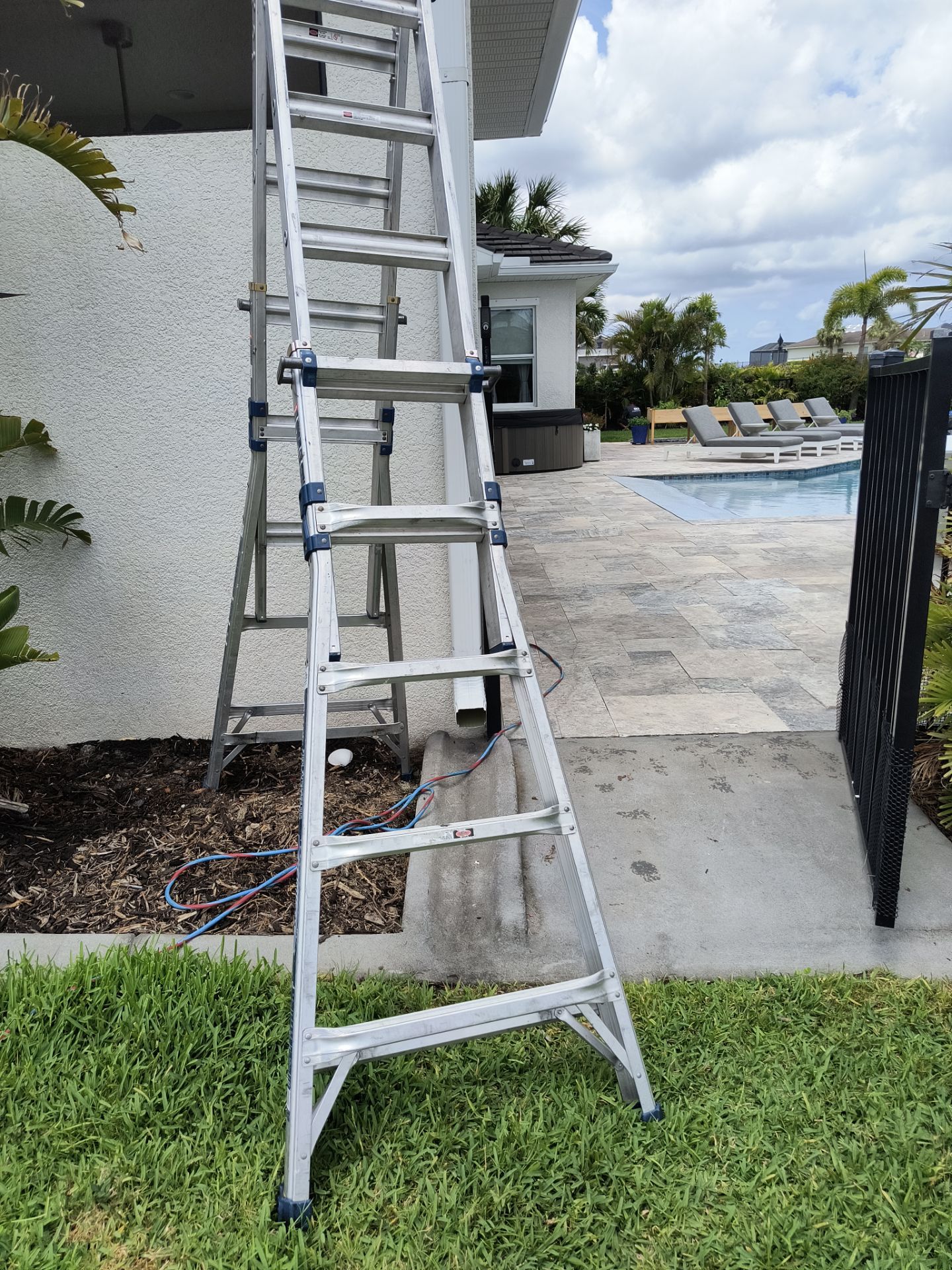 White Seamless Gutters with Downspouts in Bradenton FL by Gutter Professors
