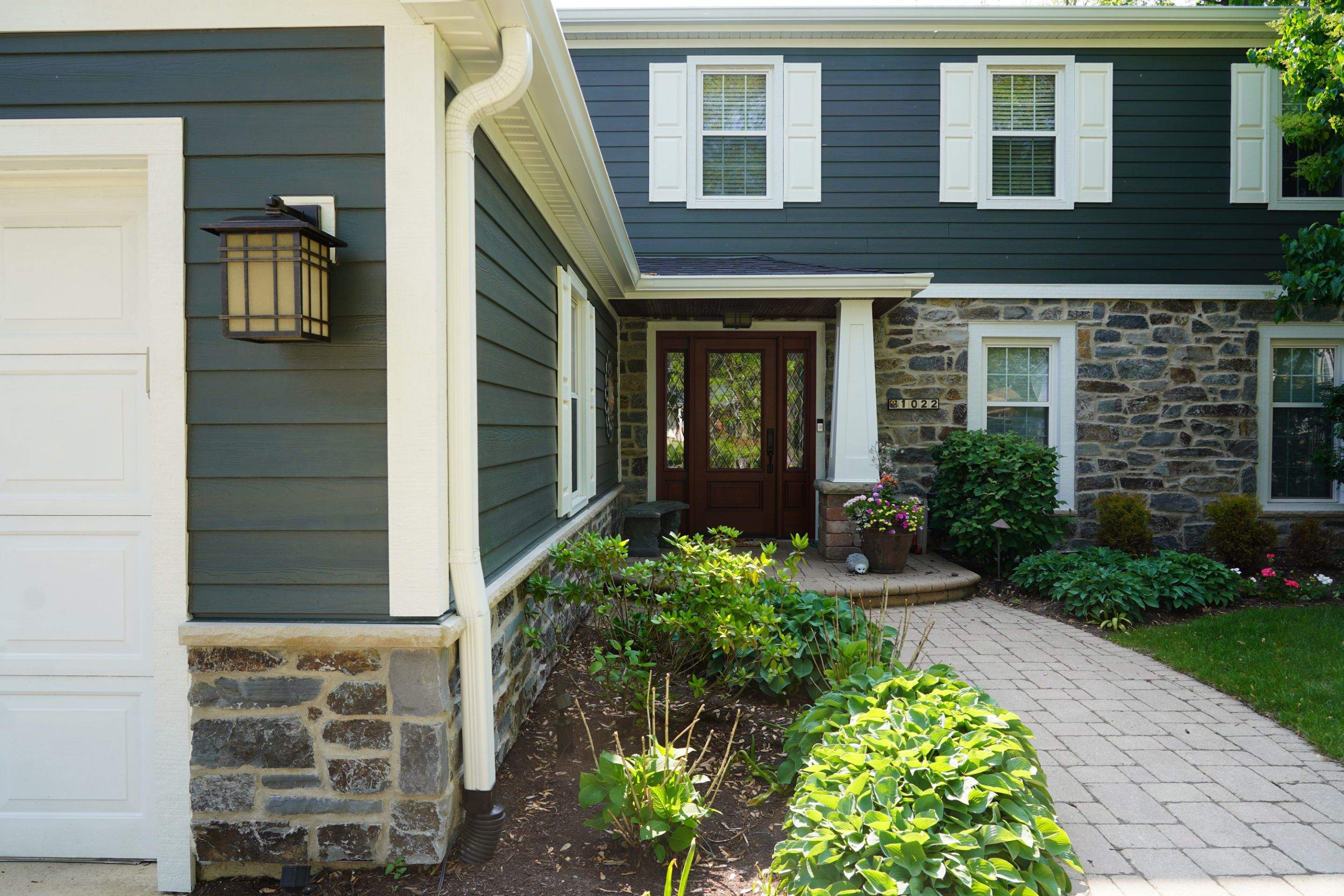 Exterior Renovation with James Hardie Siding and Natural Stone in Lombard by Great American Exteriors