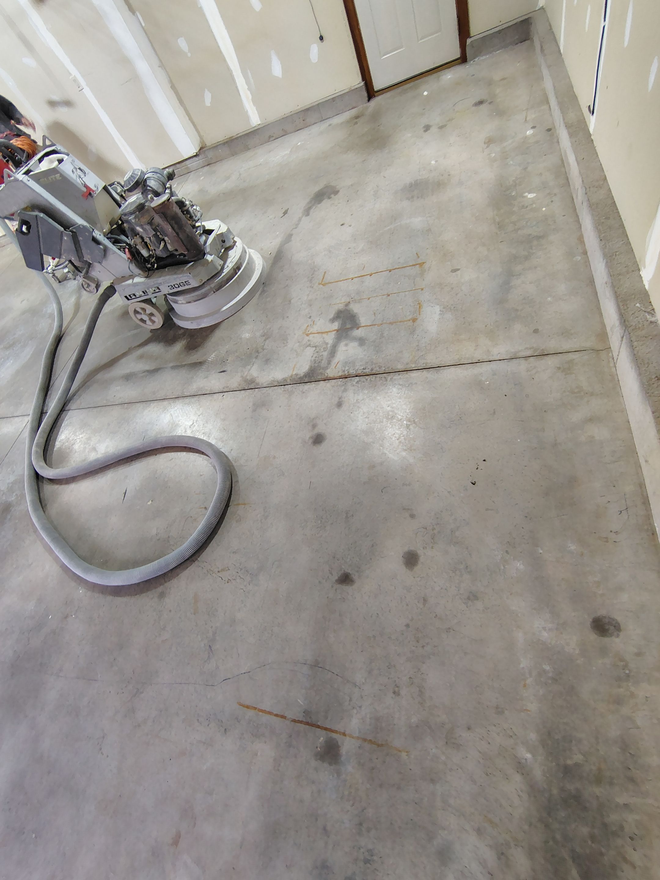 Multi-Car Garage Concrete Coating and Epoxy Finish in Sioux Falls by Select Painting, Coatings & Garage Cabinets