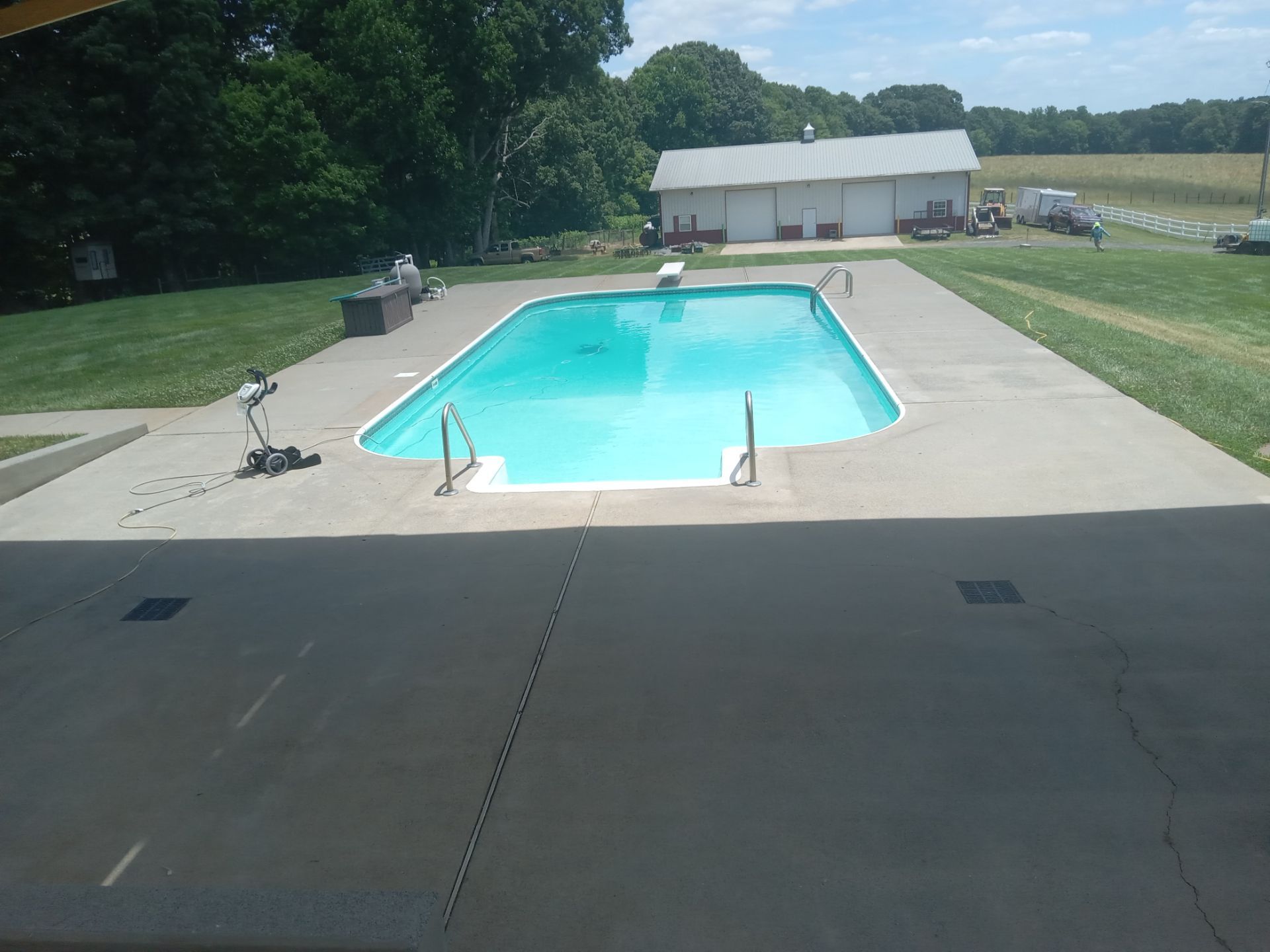 pressure washing pool deck surface cleaning to remove dirt grime for a clean outdoor area