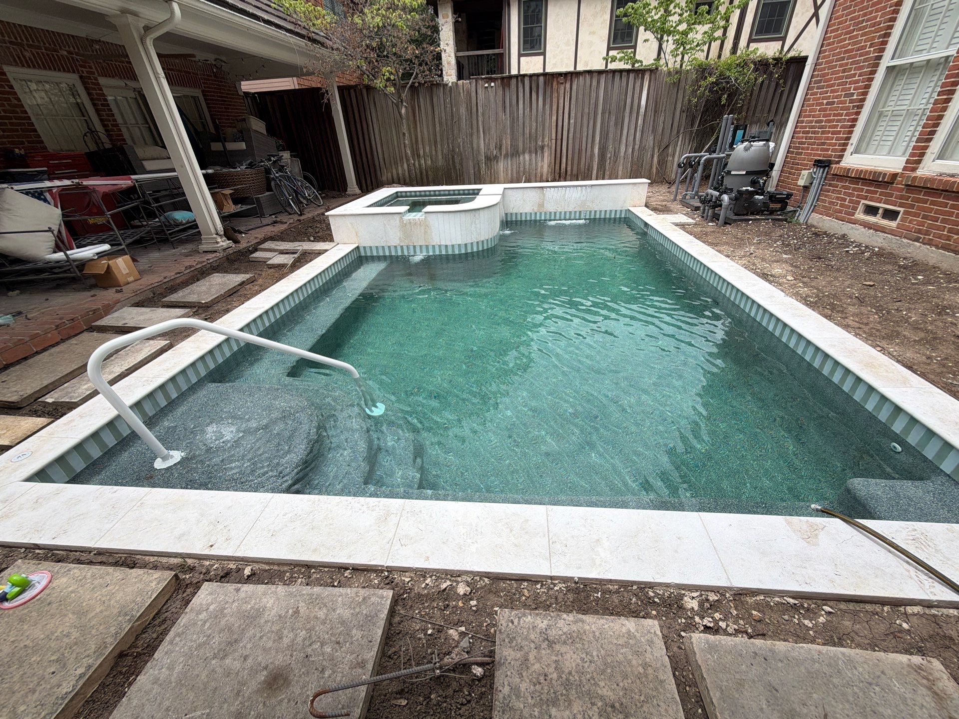 Modern Geometric Pool with Raised Spa and Travertine Deck by Pinnacle Pools and Spas - DFW