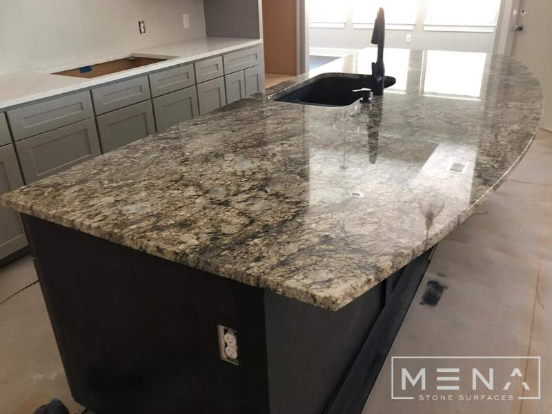 Kitchen countertops using Blue Dunes Granite by Mena stone surfaces