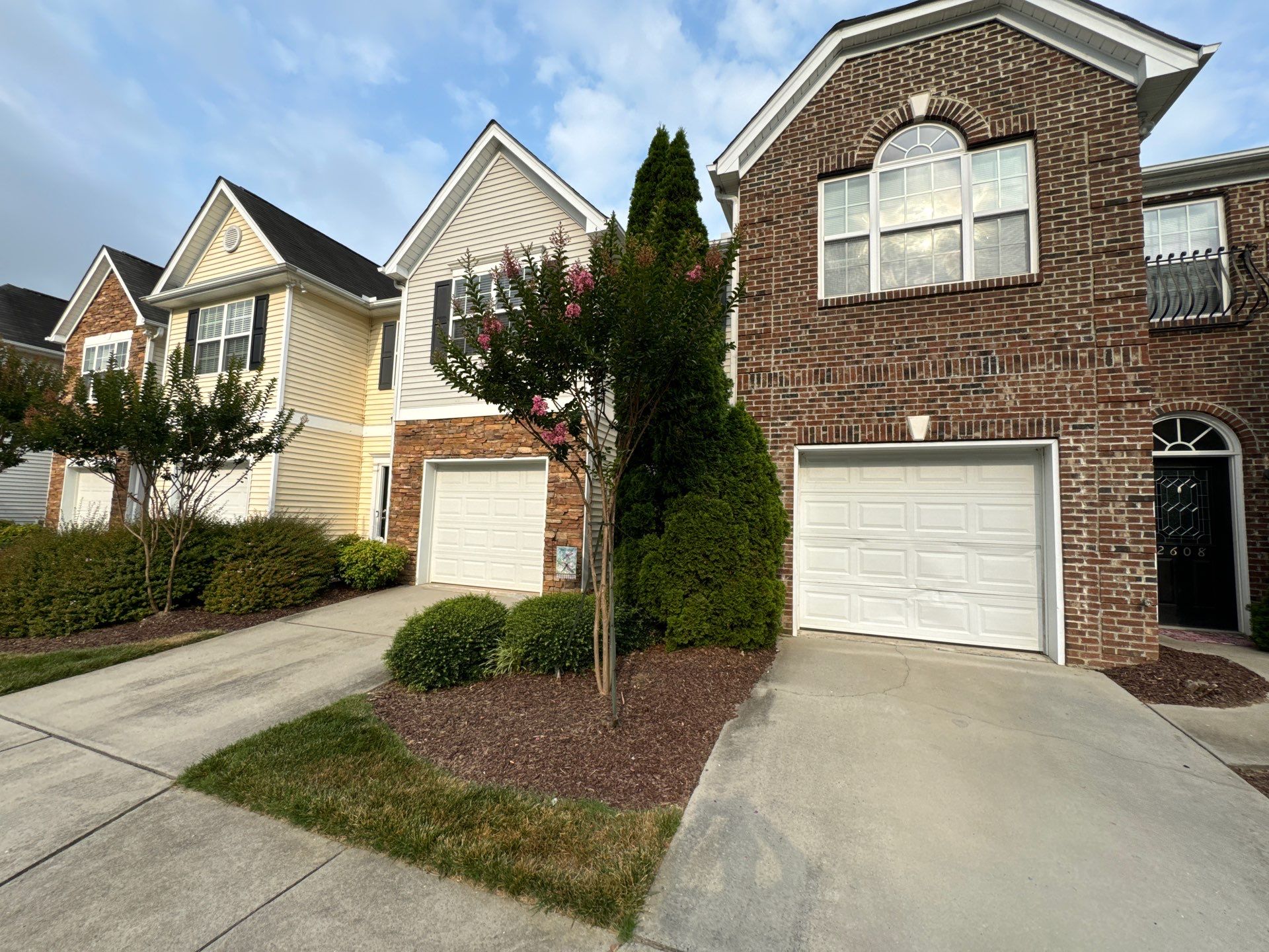 pressure washing driveway and concrete walkways removing dirt and stains restoring appearance to surfaces