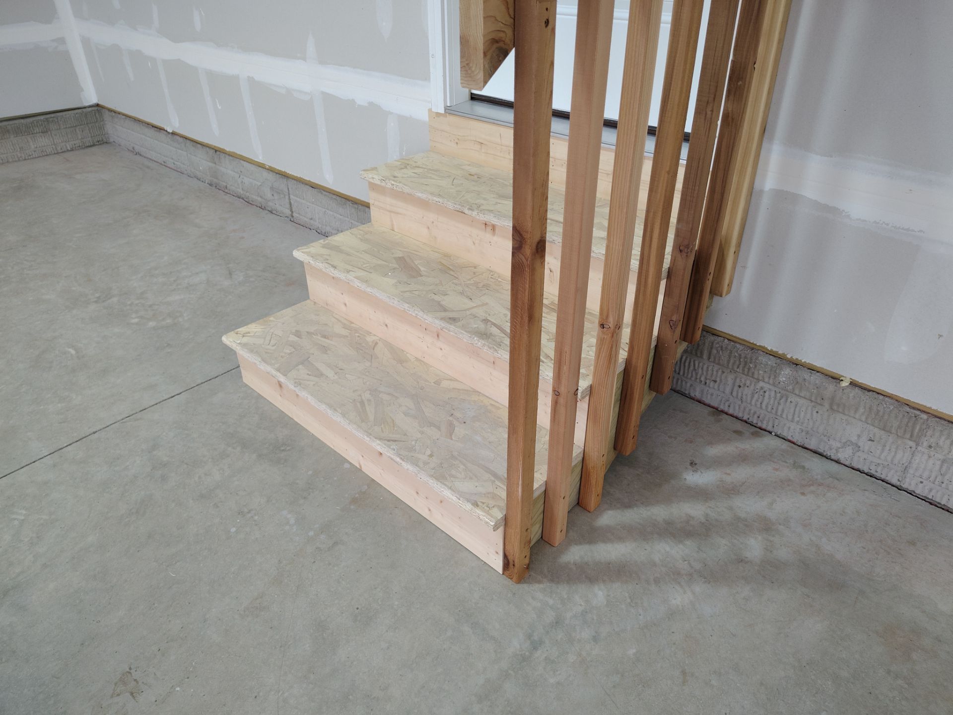 Adel, IA Garage: Complete Keystone Wrap on Floors, Stairs, and Stem Walls by Revival Concrete Coatings