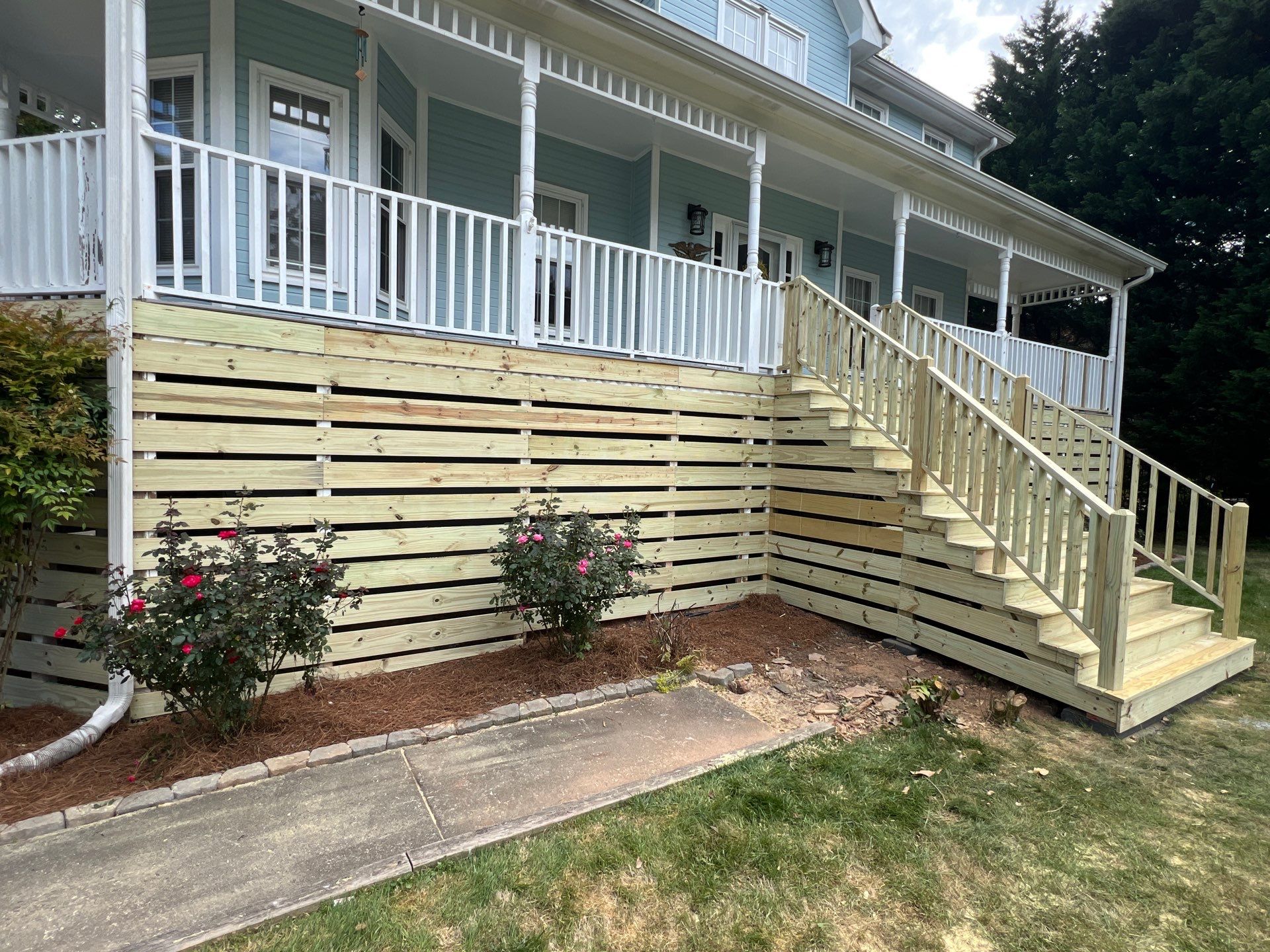 Marietta Porch Upgrade with Horizontal Pressure-Treated Wood Slats by Swift Home Renovations