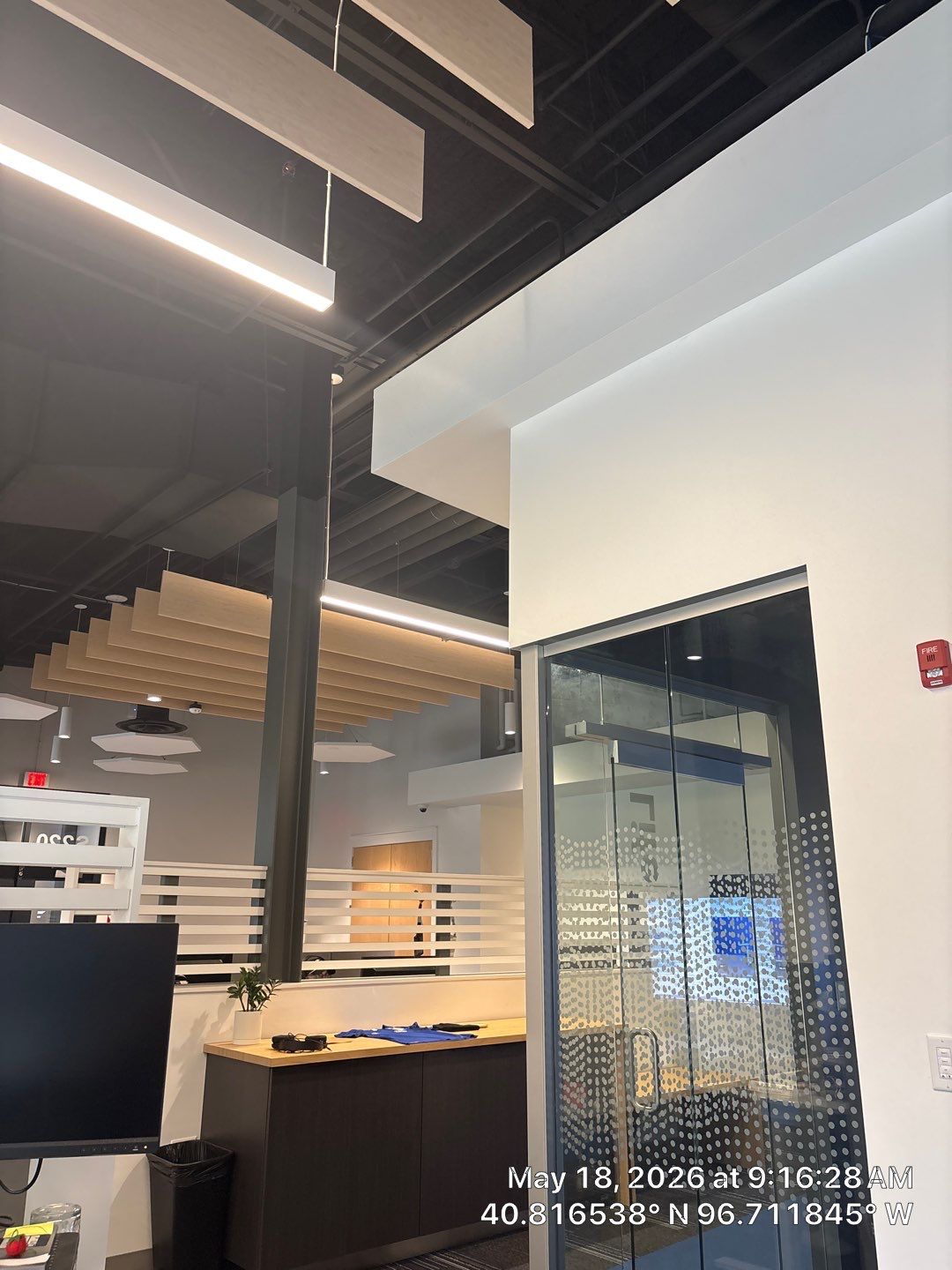 Modern Office Interior Fit-Out with Acoustic Baffles in Lincoln by CompanyCam Sales Demo