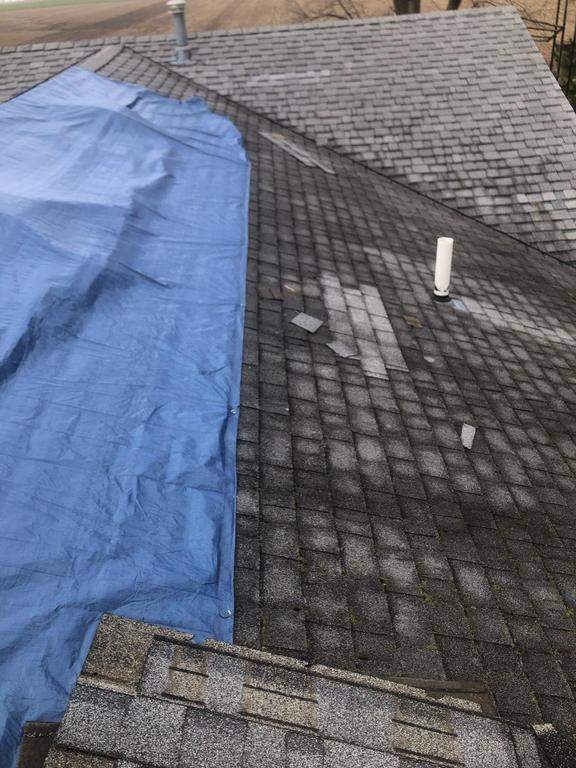 Storm damage roof replacement by Nitro Roofing and Construction