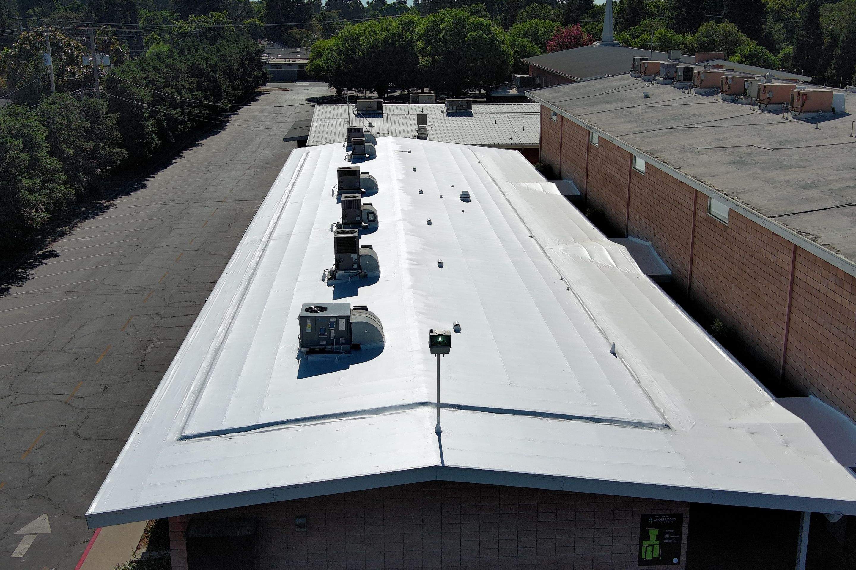 MR Roofing system using Benchmark/PUMA XL coatings over TPO single-ply roofing by Straight Edge Roofing Inc