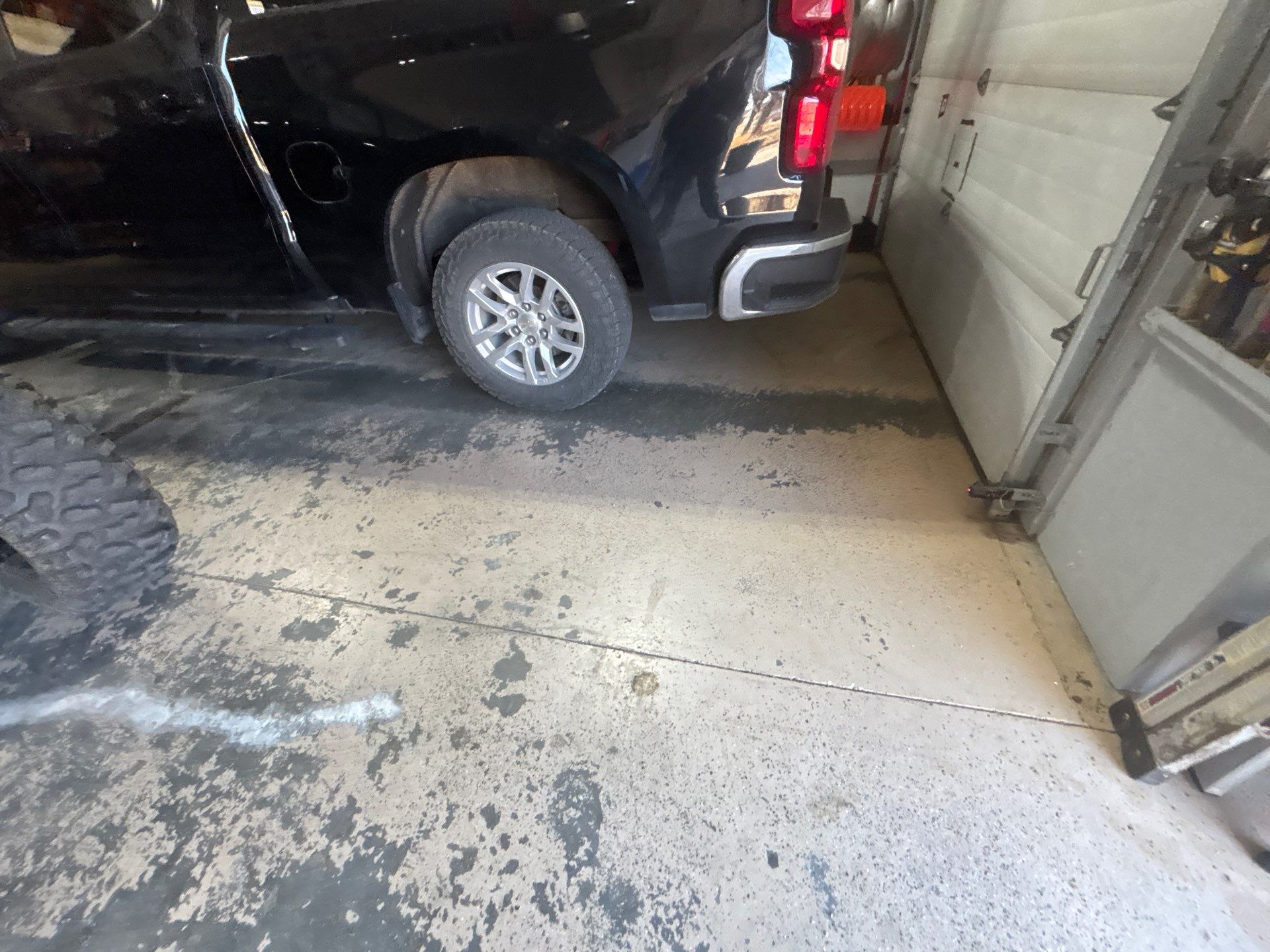 Full Garage Floor Epoxy Coating Installation in Dell Rapids by Select Painting, Coatings & Garage Cabinets