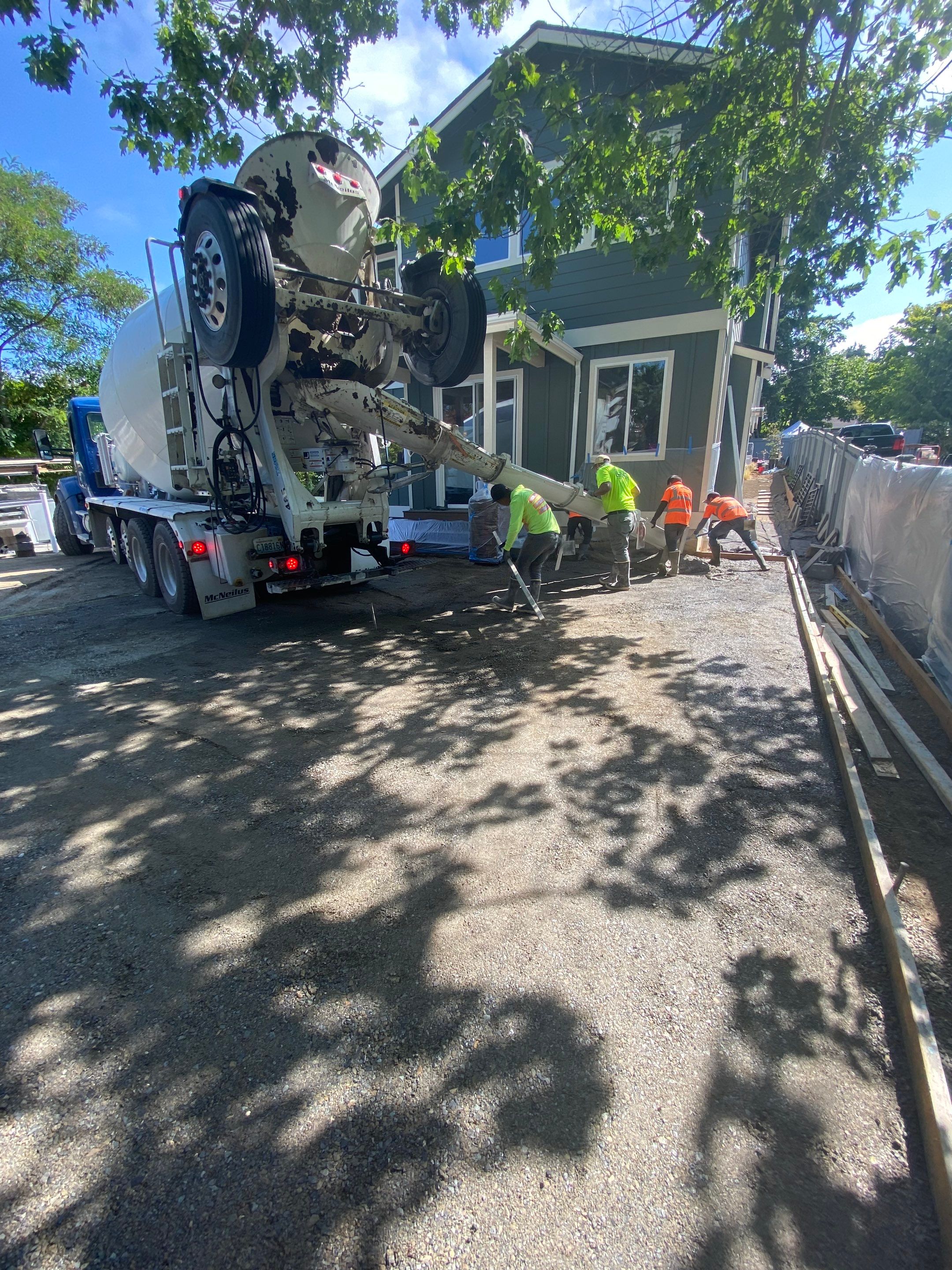 Patio Installation using Concrete, Retaining walls, and Turf install by Jireh Asphalt & Concrete Inc 
