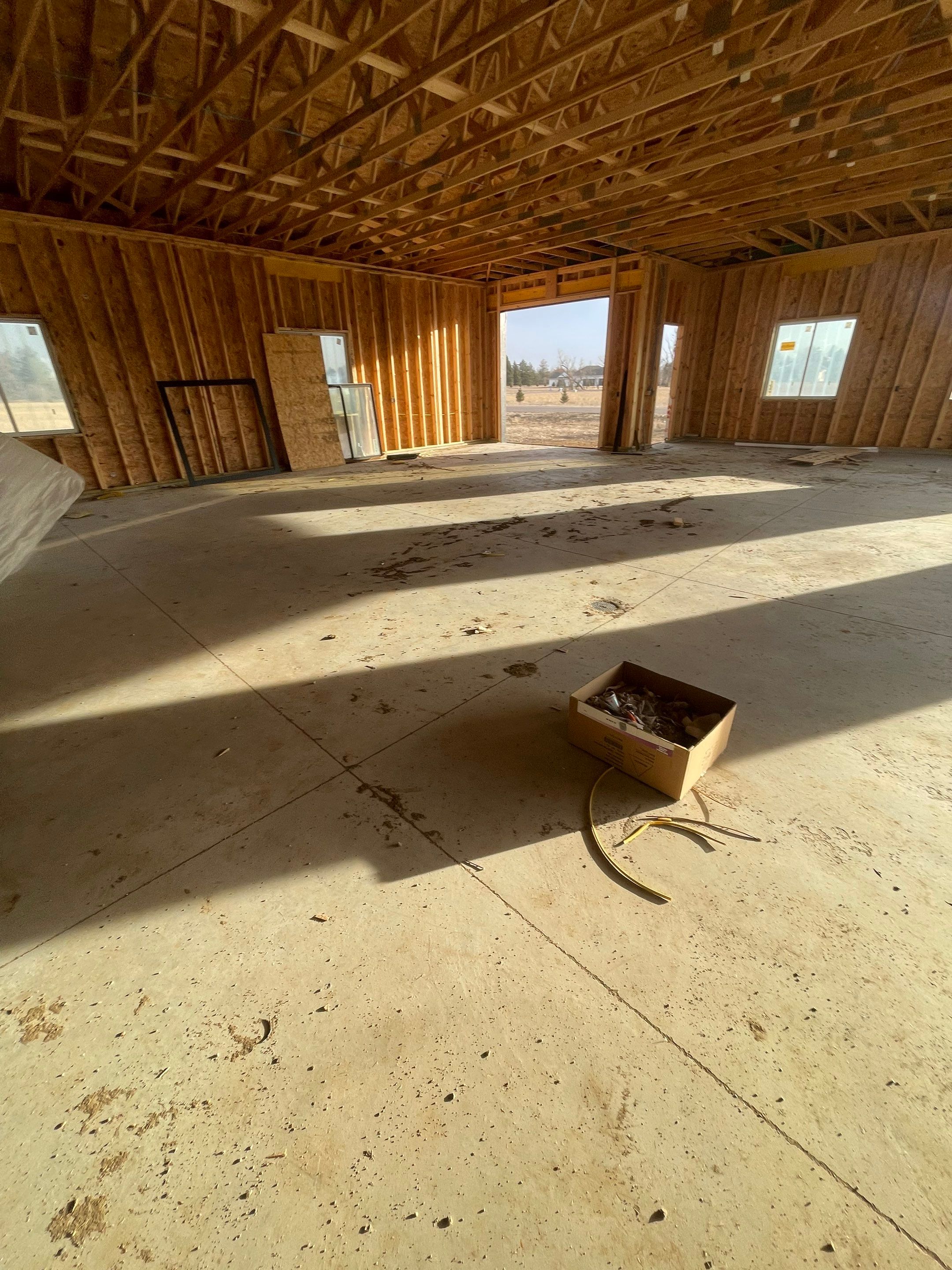 Multi-Bay Garage Concrete Coating and Floor Refinishing in South Dakota by Select Painting, Coatings & Garage Cabinets