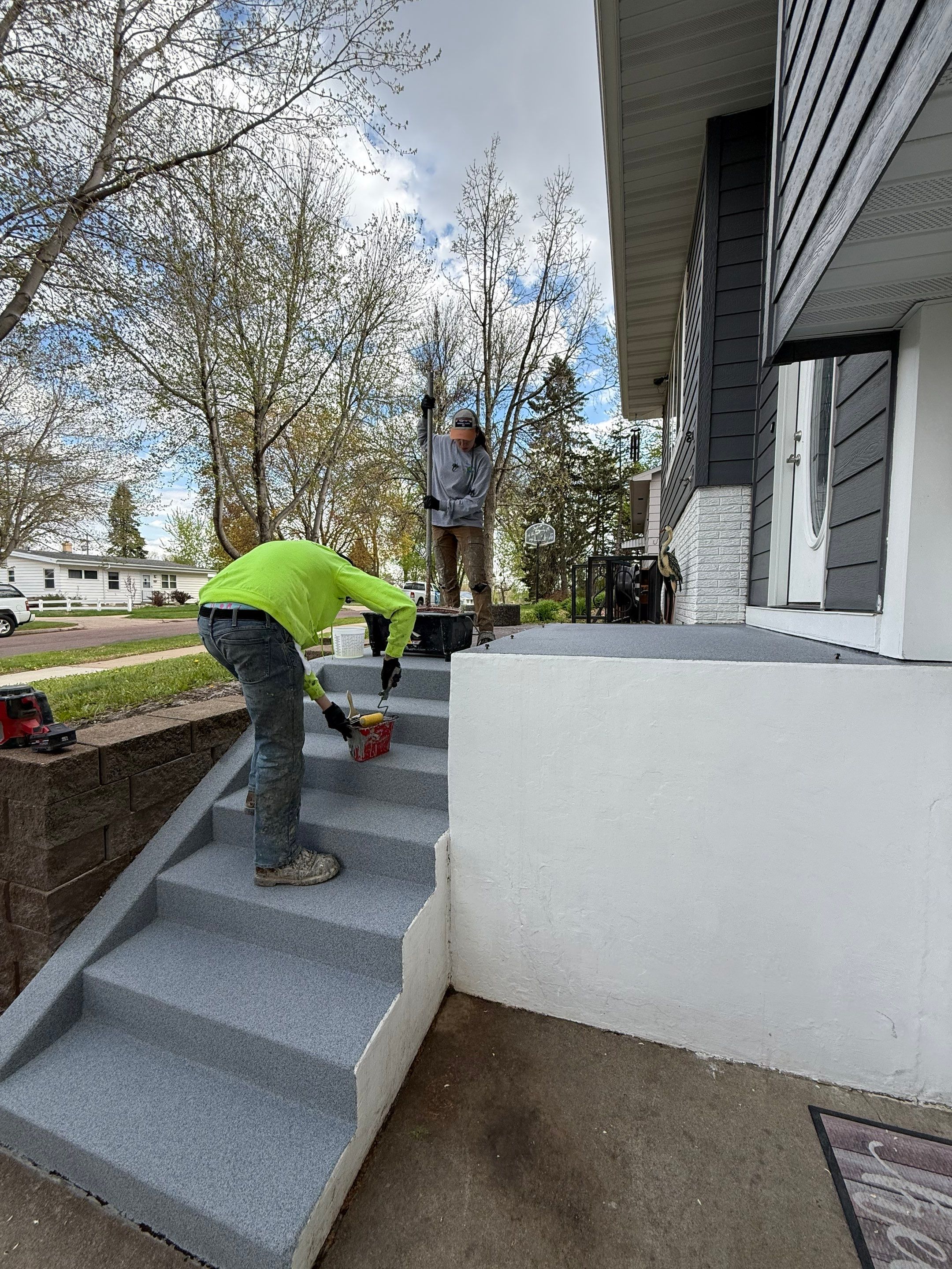 Grey Polyaspartic Porch and Stair Resurfacing in Sioux Falls by Select Painting, Coatings & Garage Cabinets