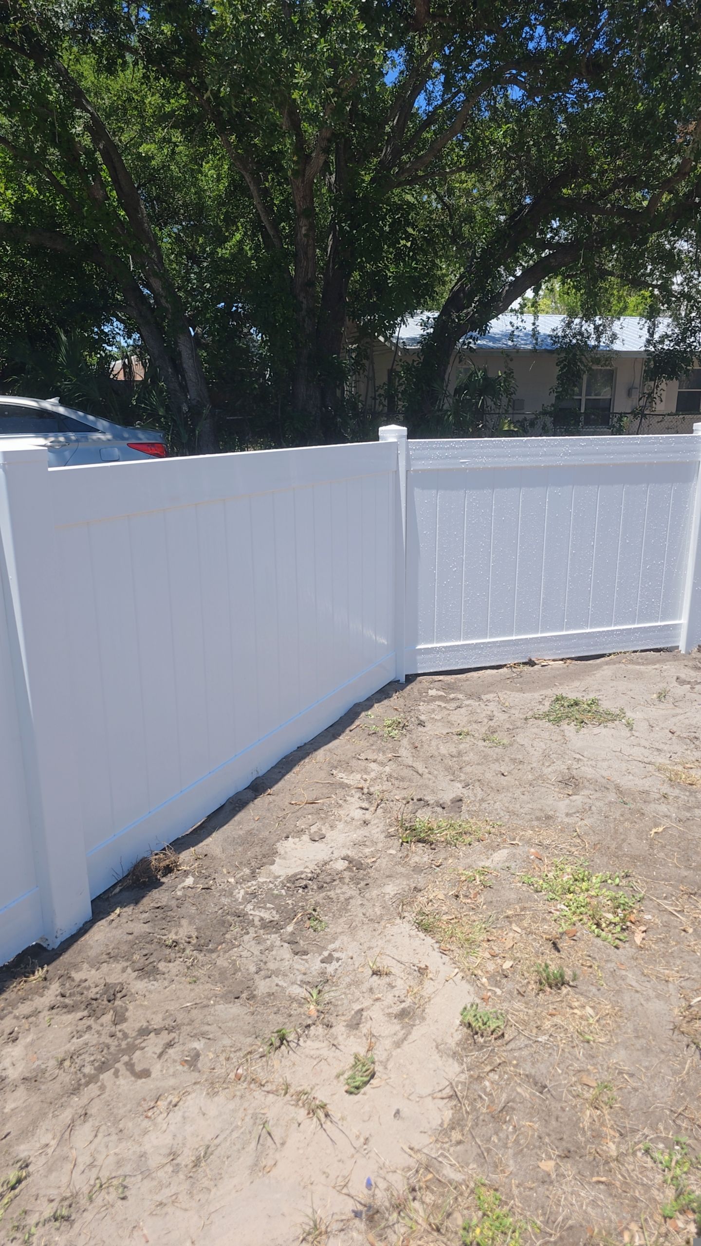 White Vinyl Privacy Fence and Gate Installation in Bradenton by True Fence LLC