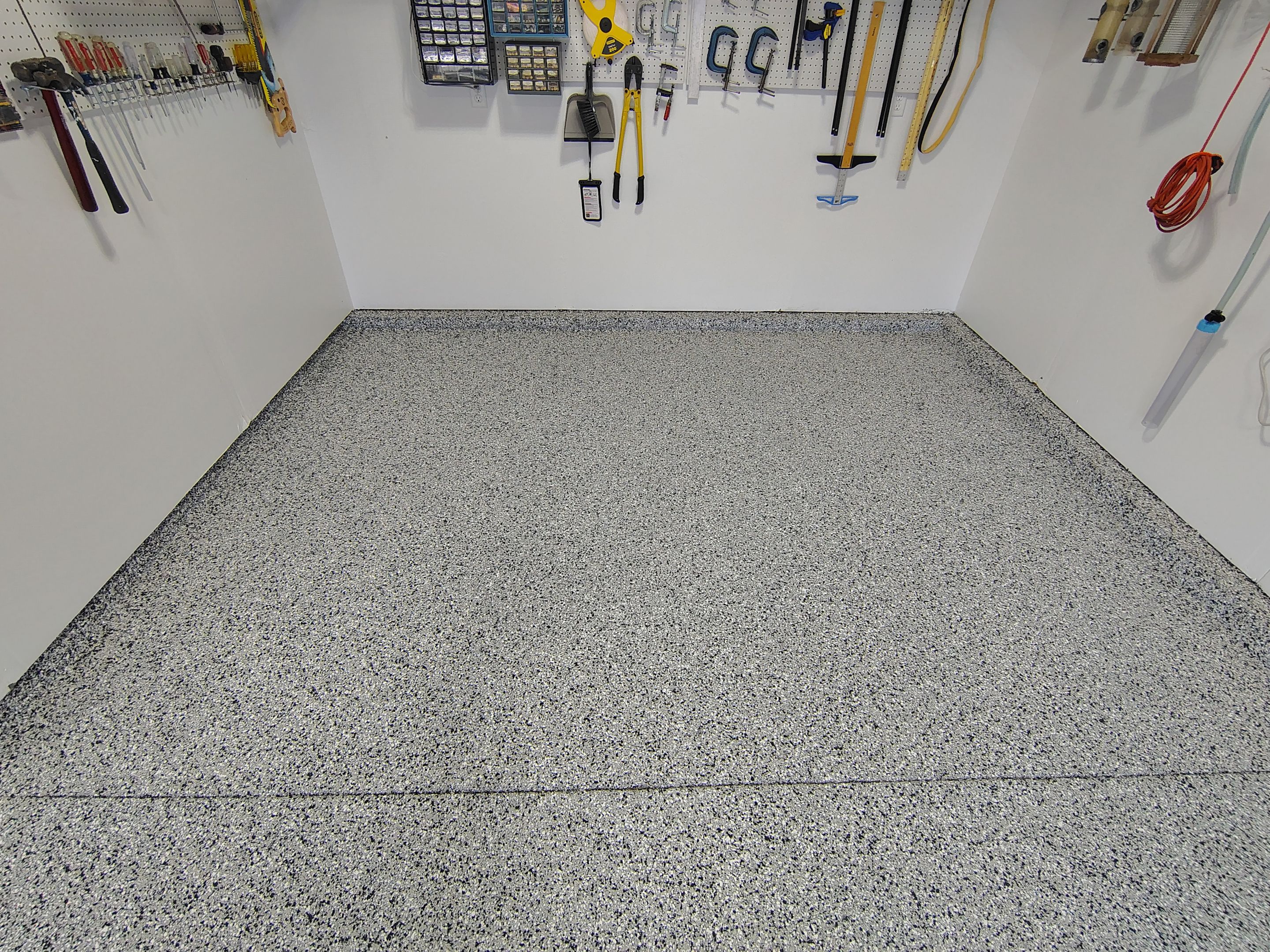 Decorative Flake Garage Floor Coating Installation in Tea, South Dakota by Select Painting, Coatings & Garage Cabinets