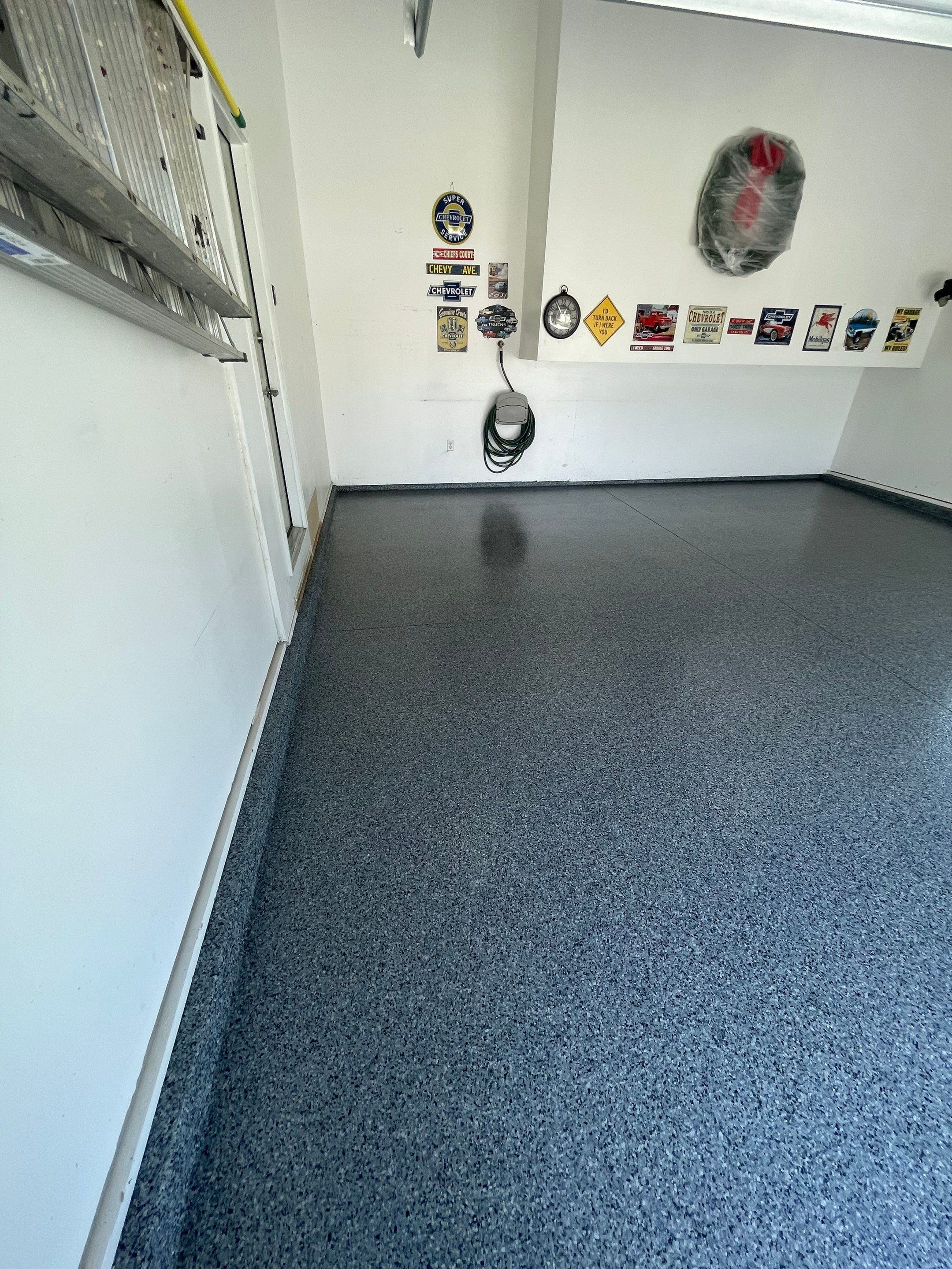 Sioux Falls Garage Floor Coating with Nightfall Decorative Chips by Select Painting, Coatings & Garage Cabinets