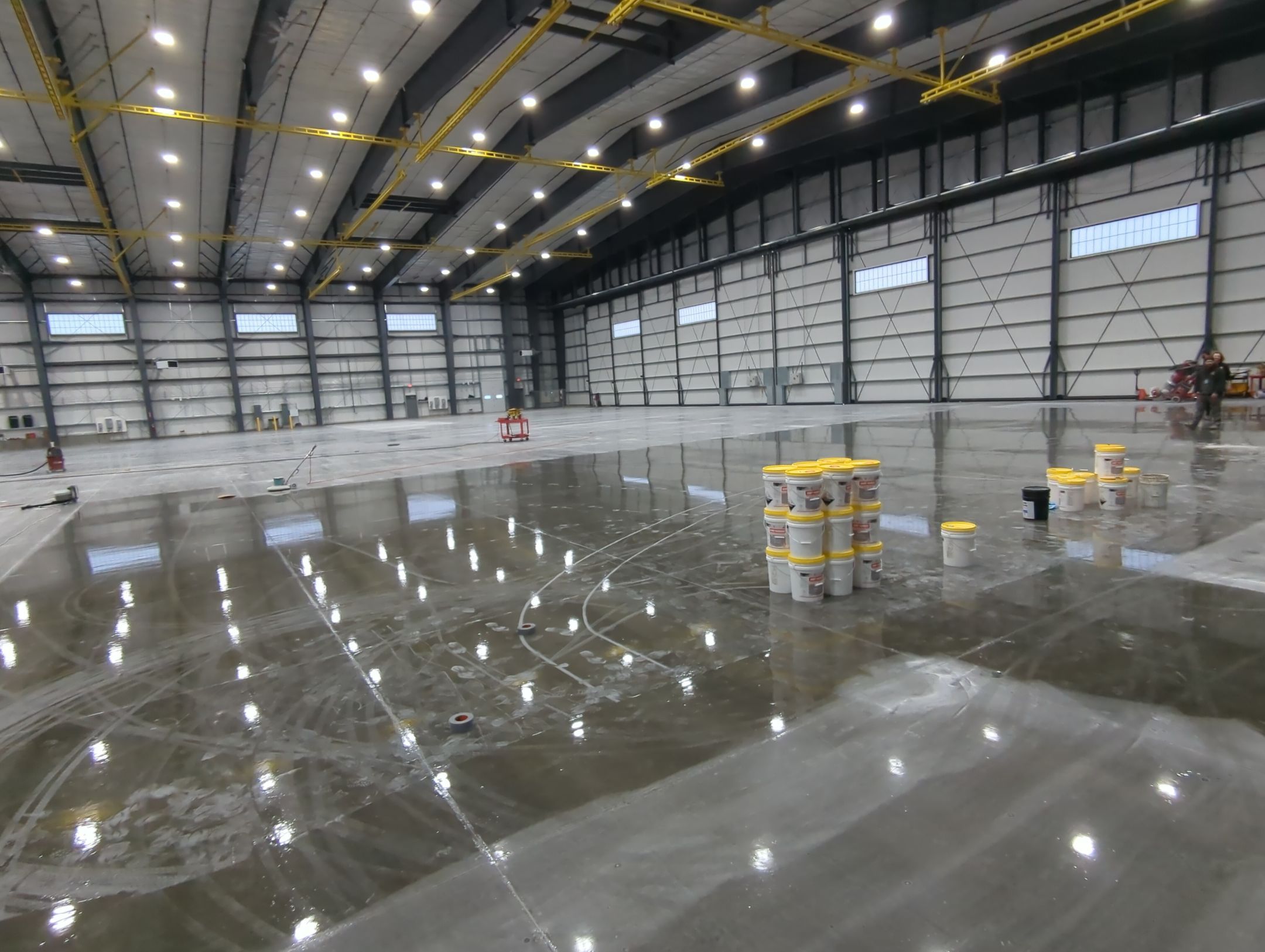 Airplane Hanger using Light Grey Commercial Penntek Epoxy by Croc Coatings, LLC