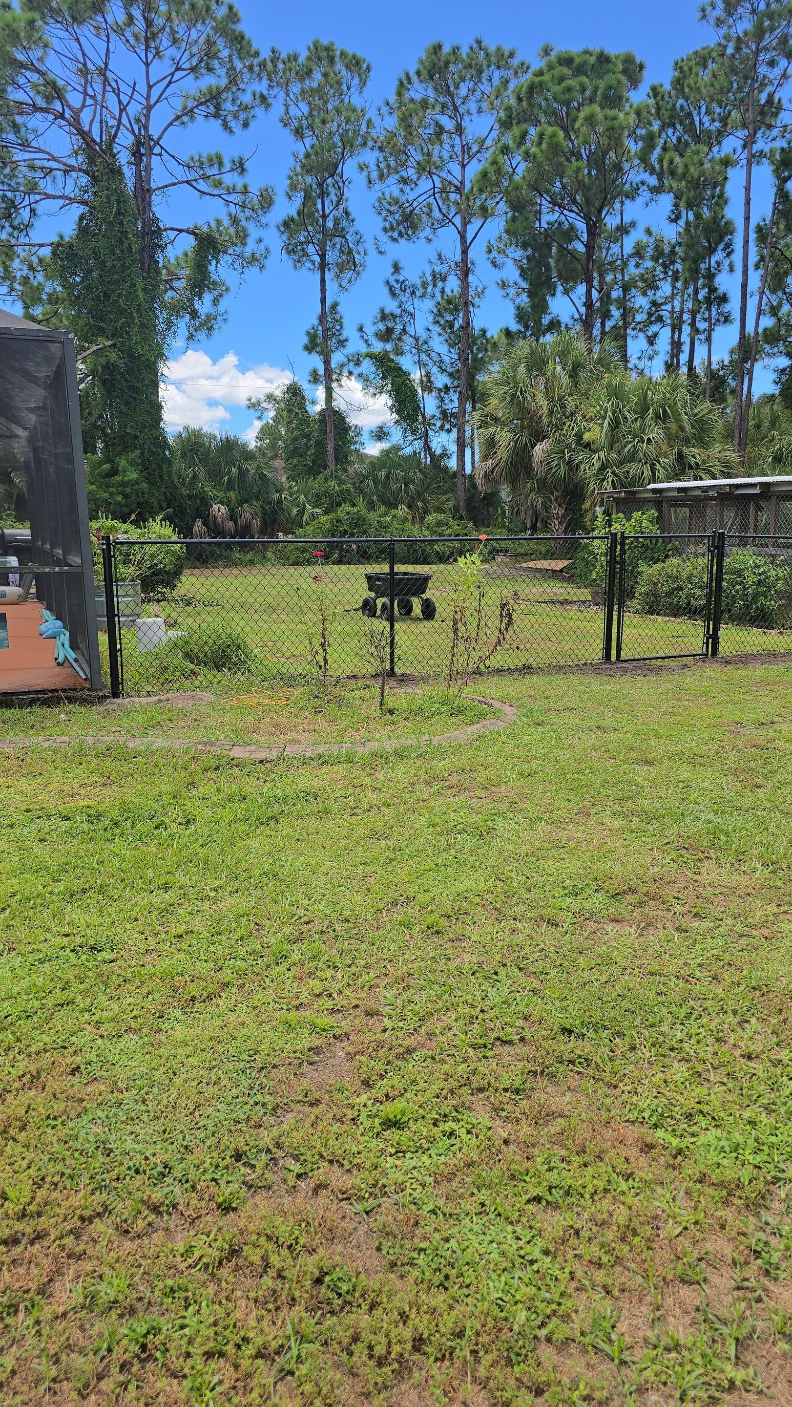 Black Chain Link Perimeter Fencing for North Port Residential Property by True Fence LLC