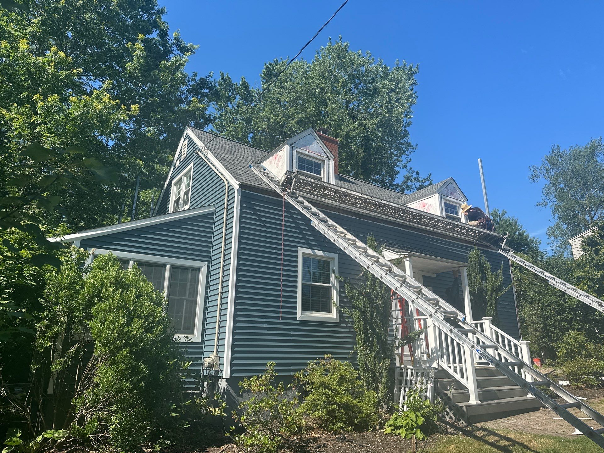 Complete Exterior Estate gray with Pacific Blue Siding by A Plus Exterior