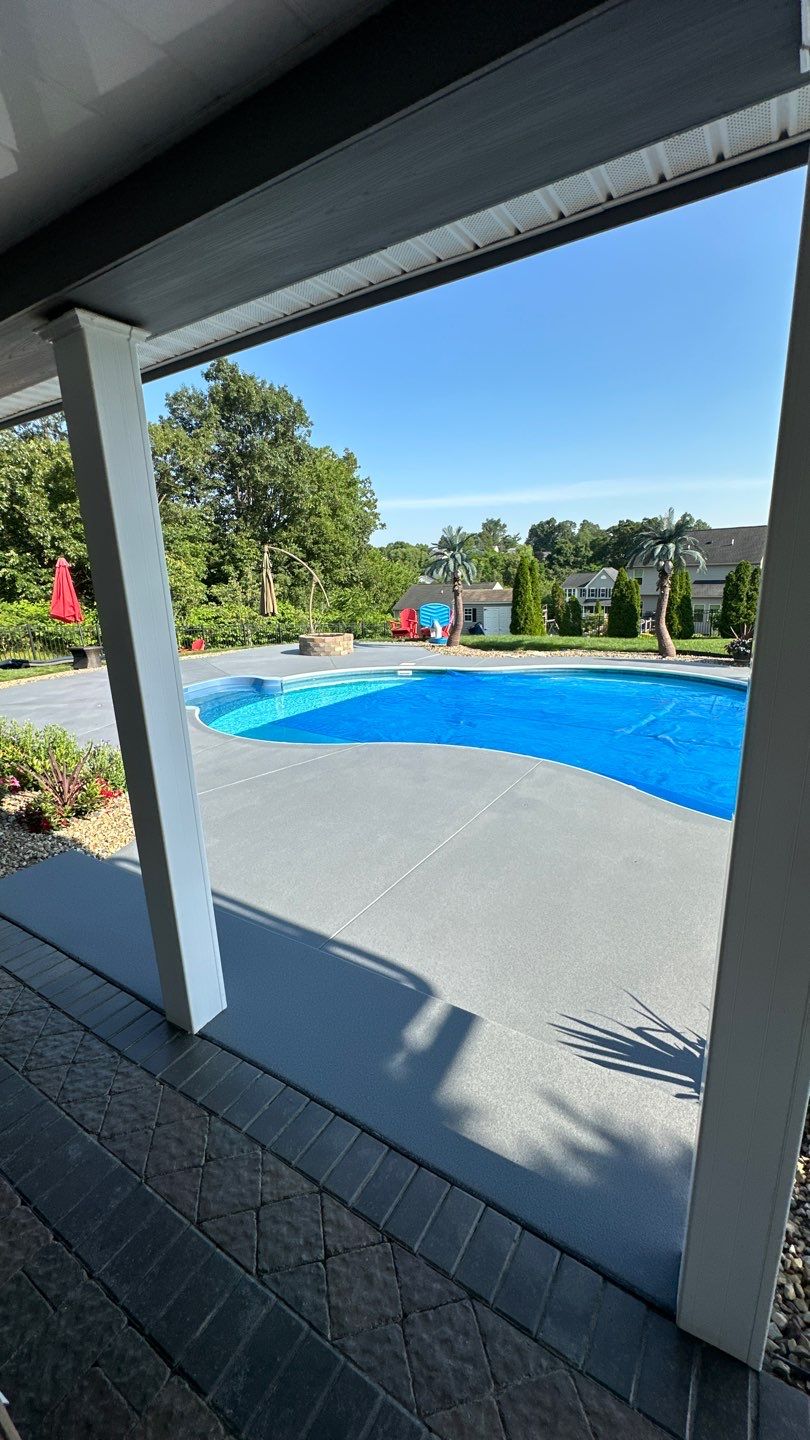 Twilight Pool Deck / Patio Project in Beaver falls by Floors in a Day, Inc