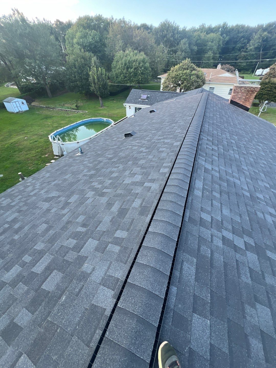 Onyx Black Shingles by Reimagine Roofing