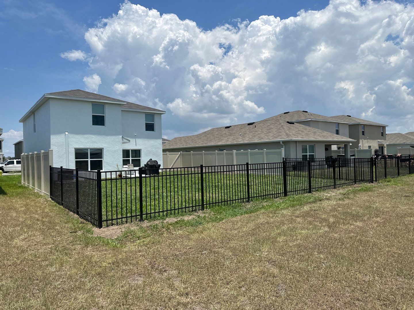 Aluminum Fence Installation using Black 3 Rail Aluminum Fence and Tan Vinyl Privacy Fence by Asap fence and gates, LLC