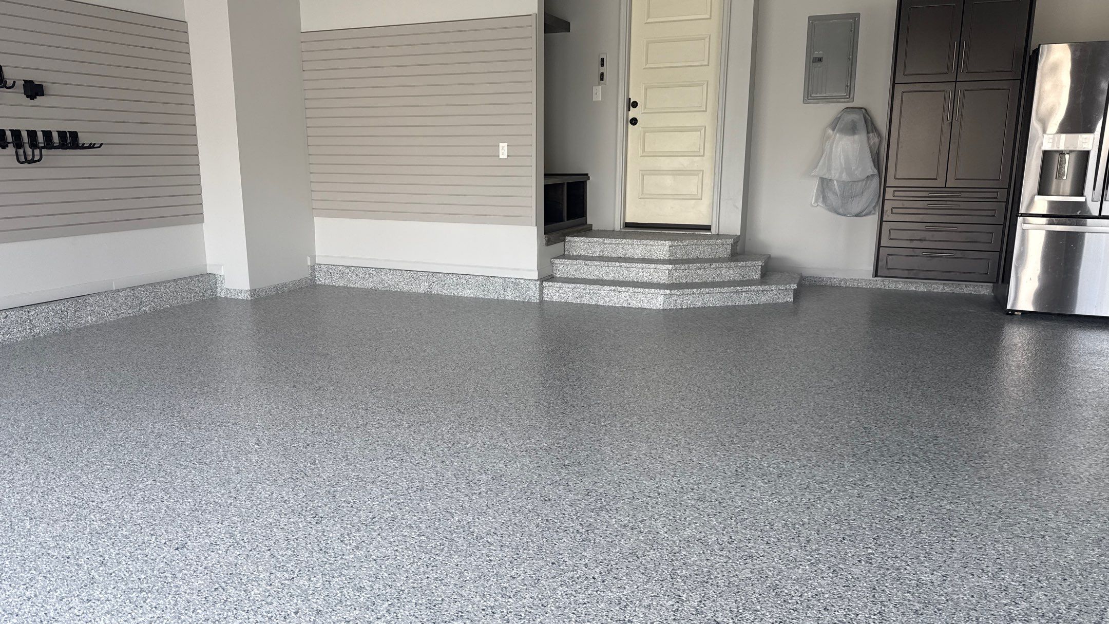 Comprehensive Garage Renovation Featuring Epoxy Flooring and Custom Storage in Shawnee by Banner Garage